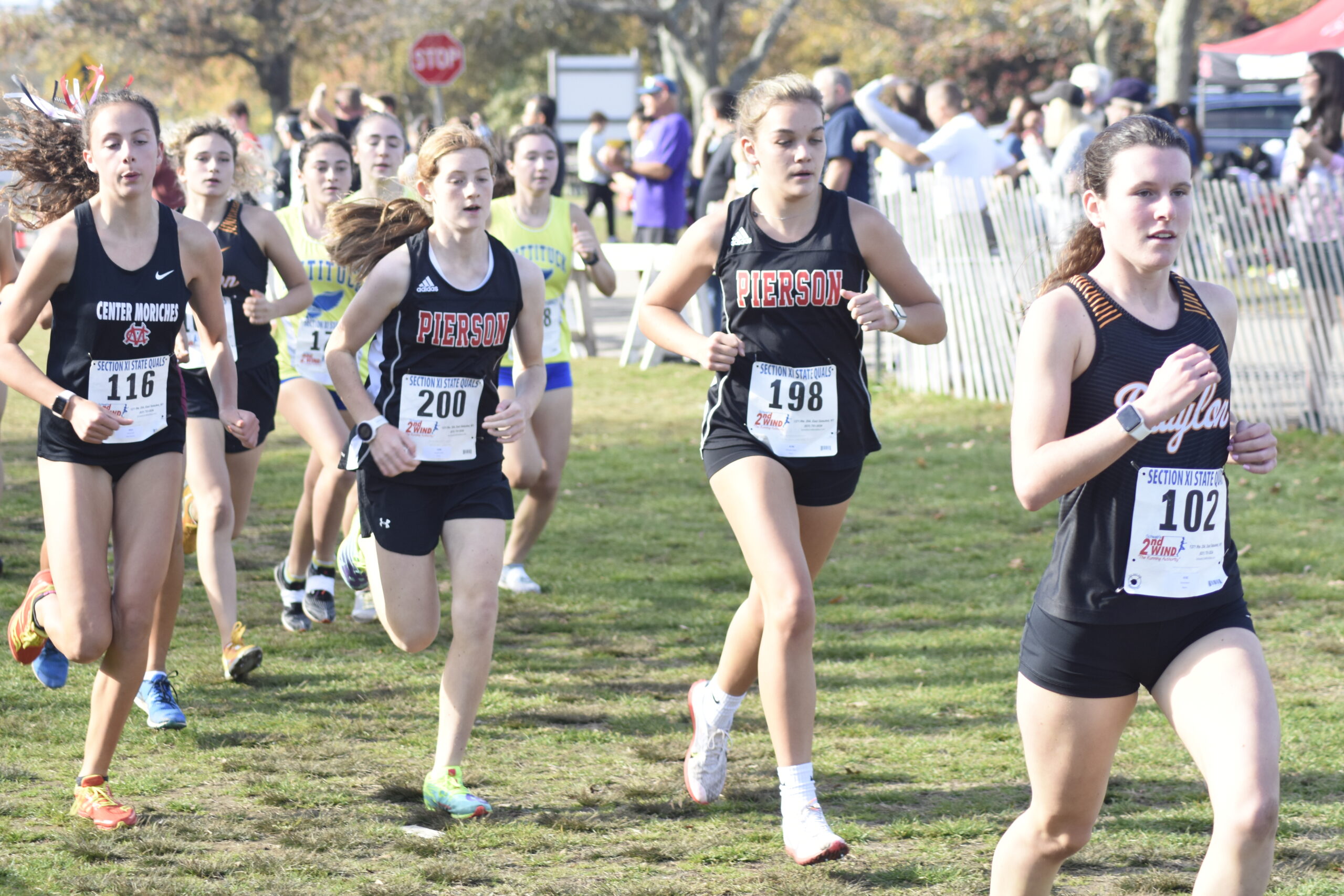 Pierson seventh-grader Josephine Mott, left, and Greylynn Guyer at the front of the pack of the Class C/D county race on Friday.    DREW BUDD