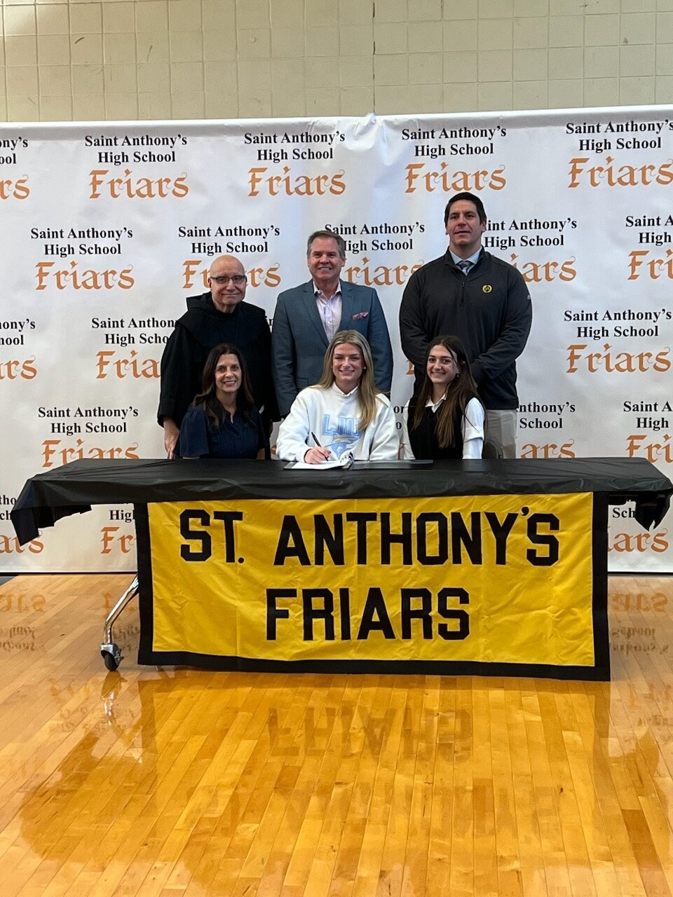 Sag Harbor resident Emma Rascelles, center, who attended Pierson High School through 10th grade before transferring to St. Anthony's, will play Division I lacrosse at Long Island University next year.