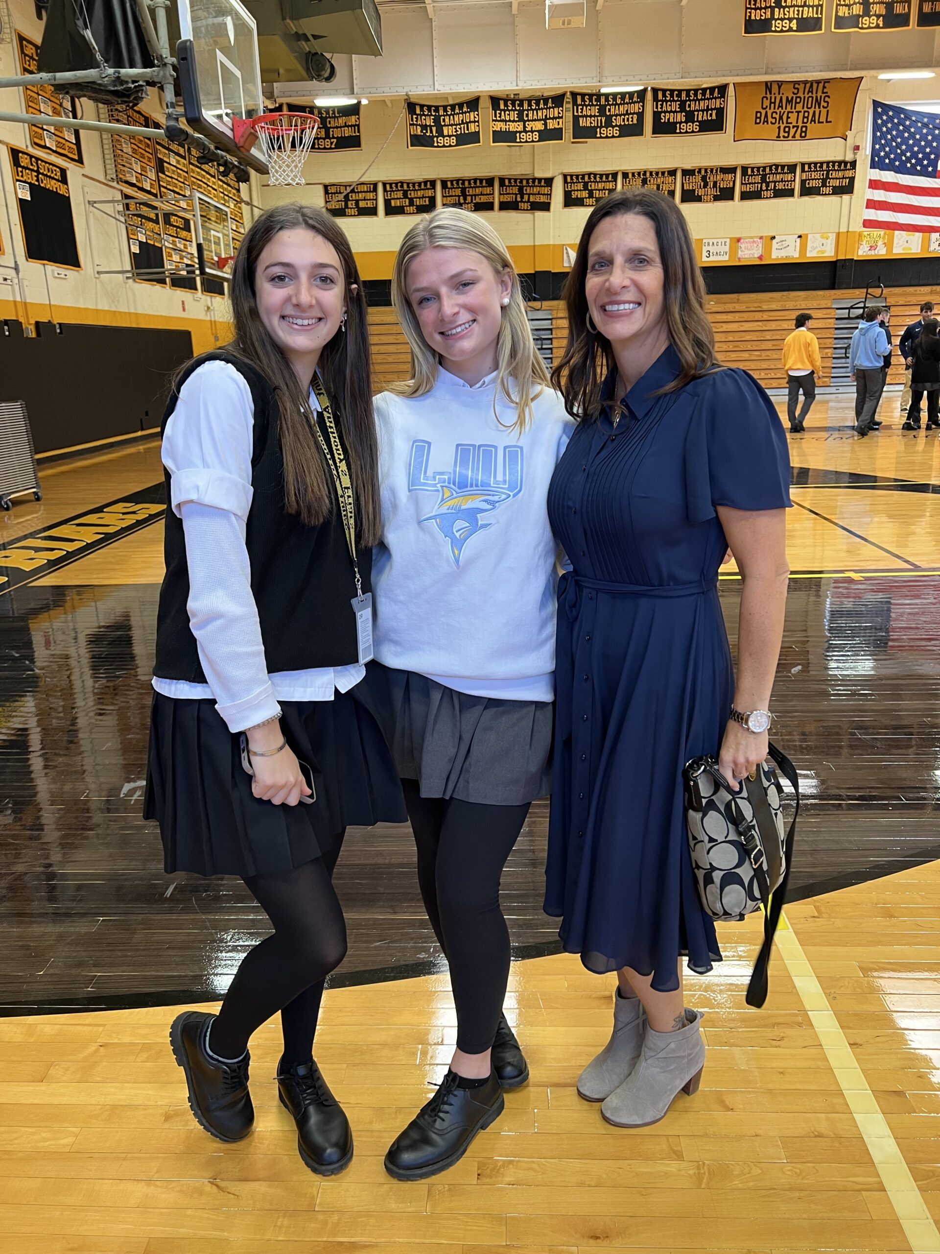 Sag Harbor resident Emma Rascelles, center, with her sister Aly and mother Beth Gualtieri.