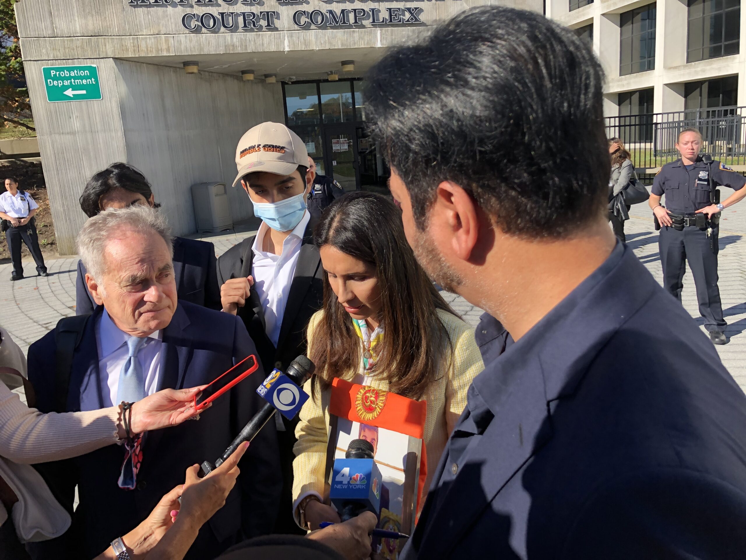 The family of Devesh Samtani speak to reporters outside the courthouse. T.E. MCMORROW