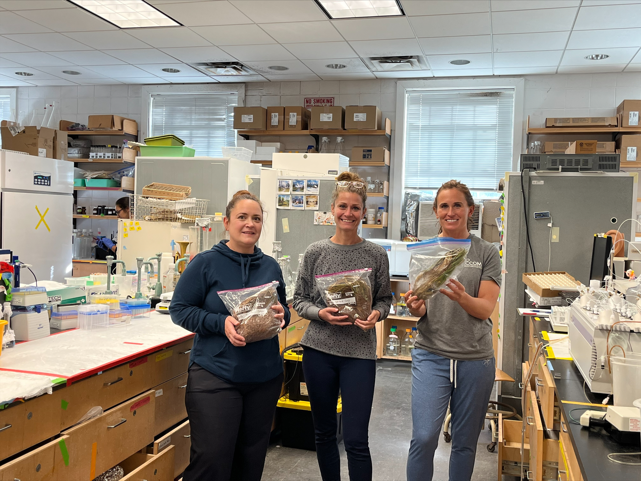 Stony Brook Lab manager Jennifer Goleski, CCOM President Laura Tooman and CCOM Program Specialist Jaime LeDuc with specimens from the Fort Pond Floating Wetland Project in Montauk that were brought to the Gobler Lab at the Stony Brook University Southampton Campus for analysis. COURTESY CONCERNED CITIZENS OF MONTAUK