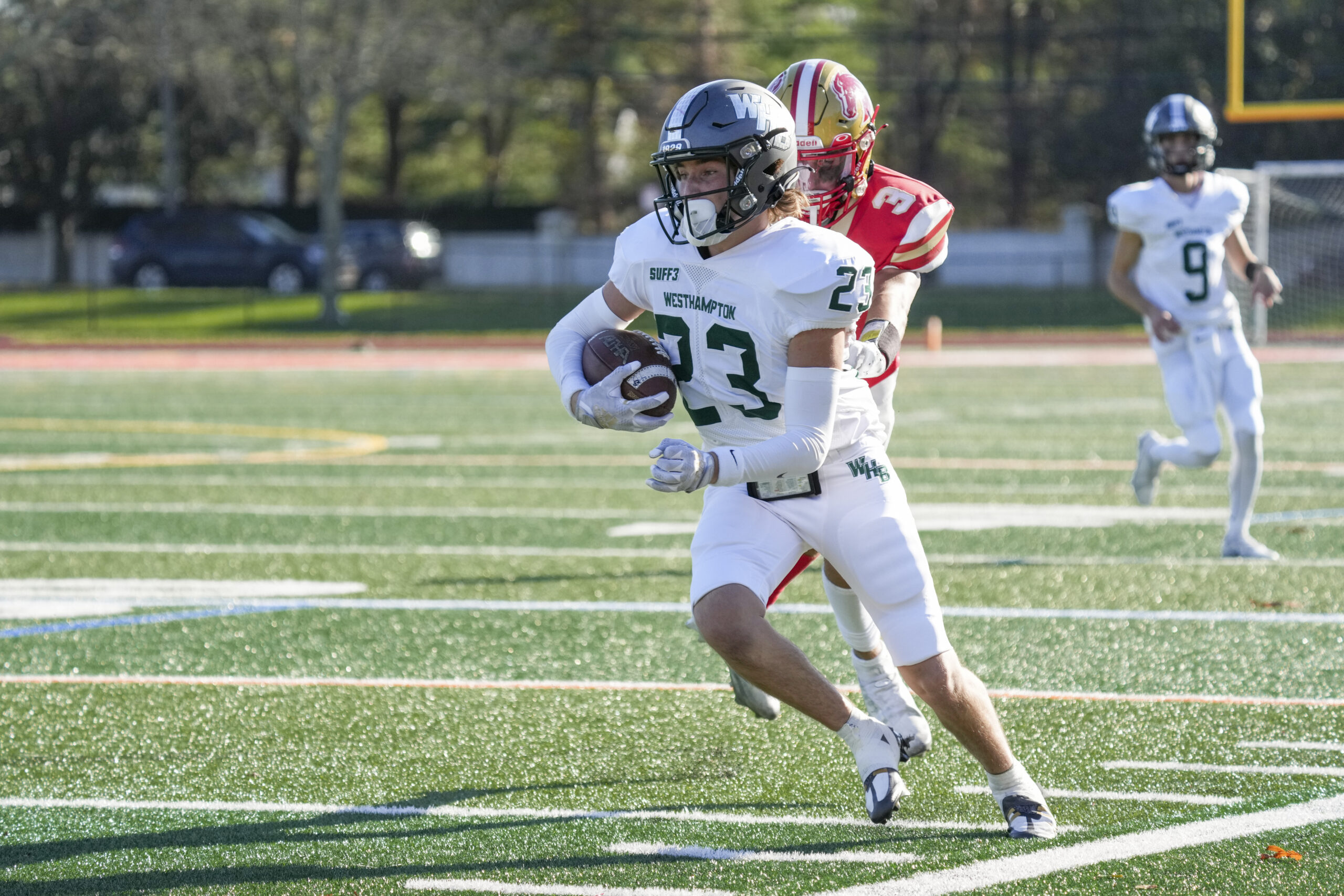 Westhampton Beach junior Heath Sumwalt gains some yards before a Hills West player catches up to him.    RON ESPOSITO