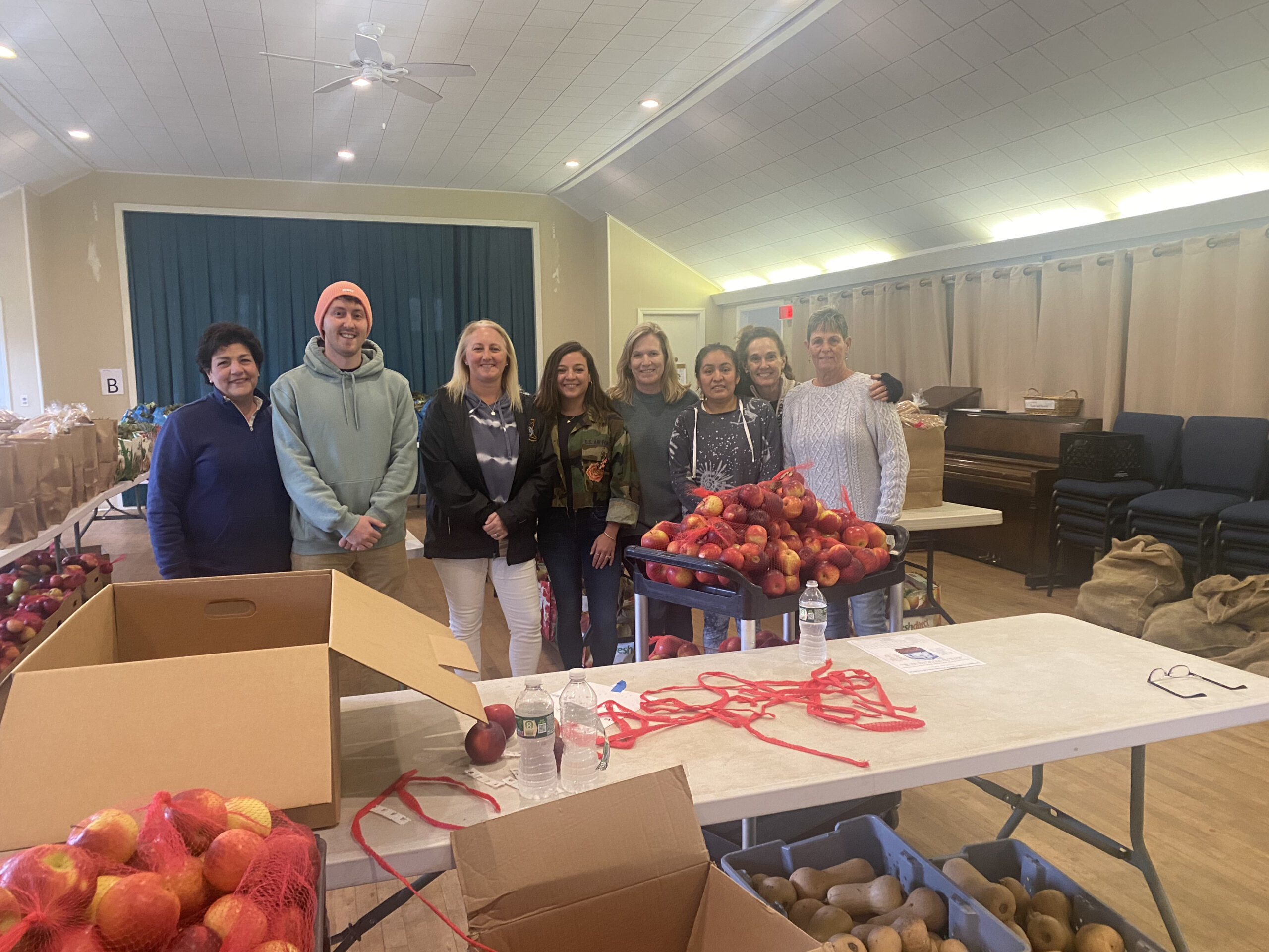 Members of the WordHampton Public Relations team, from left,  Nicole Castillo, Ashley Fresa and Ben Karlin, dropped off the items collected at a food drive honoring the firm's 30th anniversary, at the Springs Food Pantry, with help from pantry volunteers. COURTESY WORDHAMPTON
