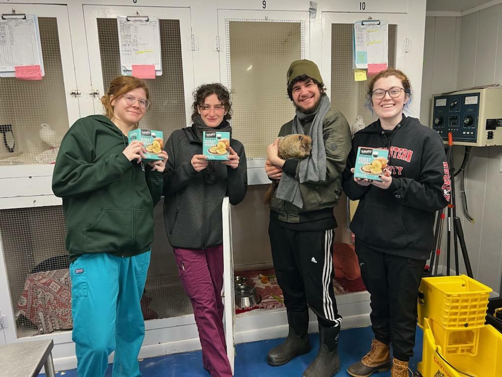 From left to right,  Mary Tracy, Grace DeNatale, Ryan Gilmartin, and Rose Lynch and Allen the groundhog with tofurkey brought by Humane LI.   COURTESY HUMANE LI