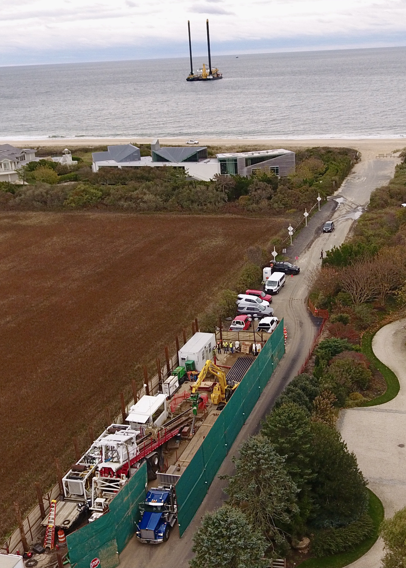 The horizontal directional drill will bore a conduit from the Beach Lane roadway, angling down 80 feet, running beneath the ocean beach and sea floor to a connection point more than 1,500 feet from shore where it will meet the cable boring running from the wind farm 50 miles to the east.