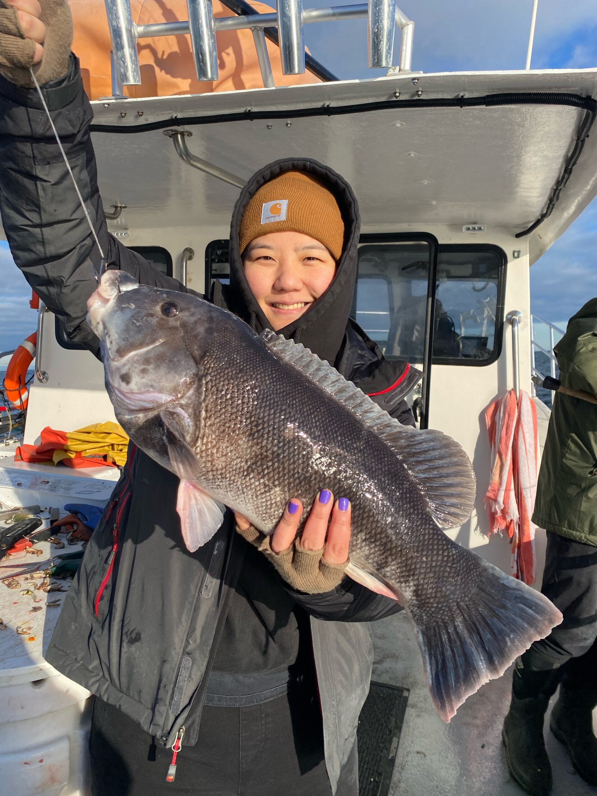 Helen Cho shows off a big Montauk blackfish caught aboard the charter boat Double D recently.