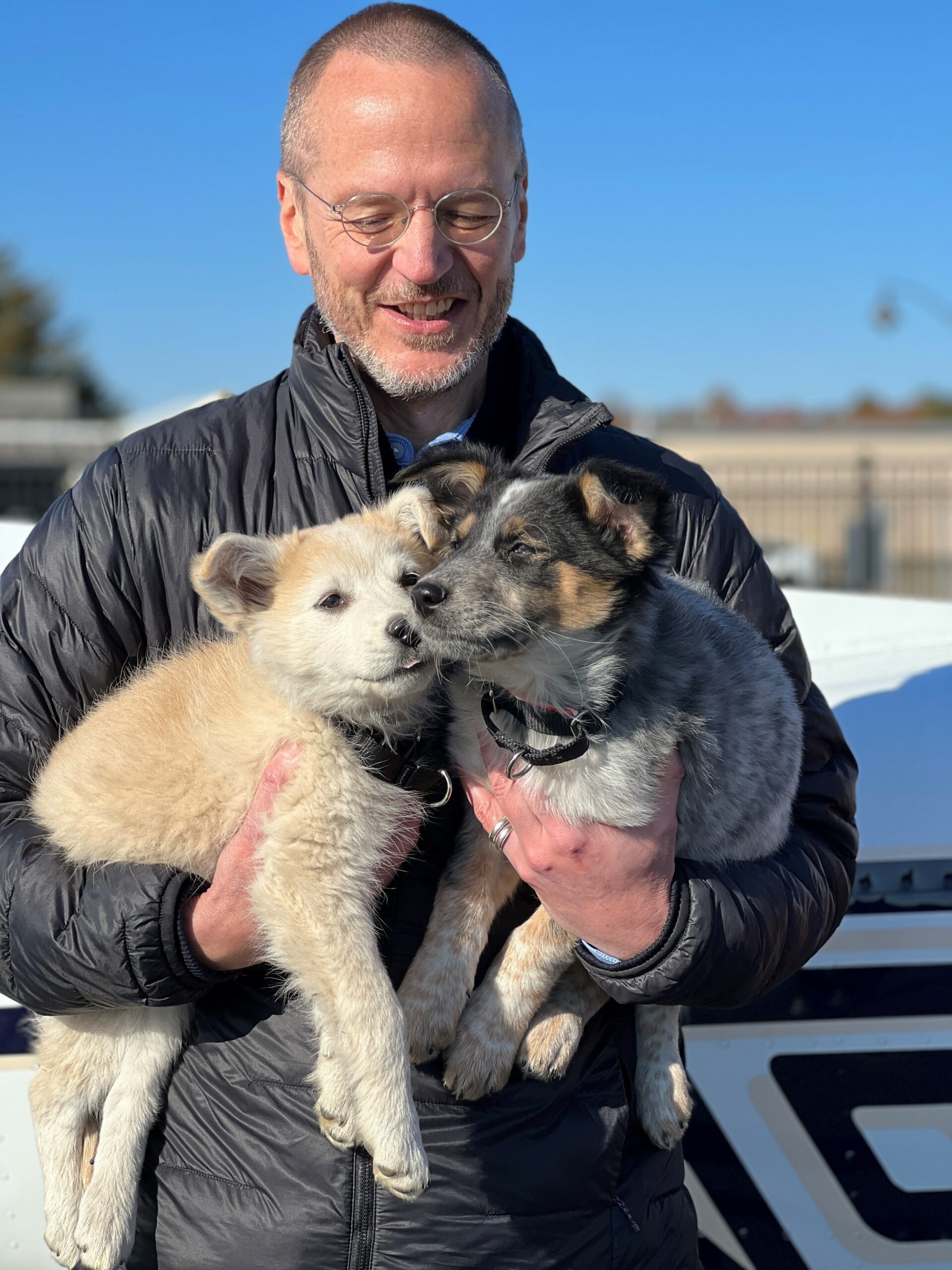 Animal Rescue Fund of the Hamptons Executive Director Scott Howe holds Biscochito and Blue Corn. COURTESY ANIMAL RESCUE FUND OF THE HAMPTONS