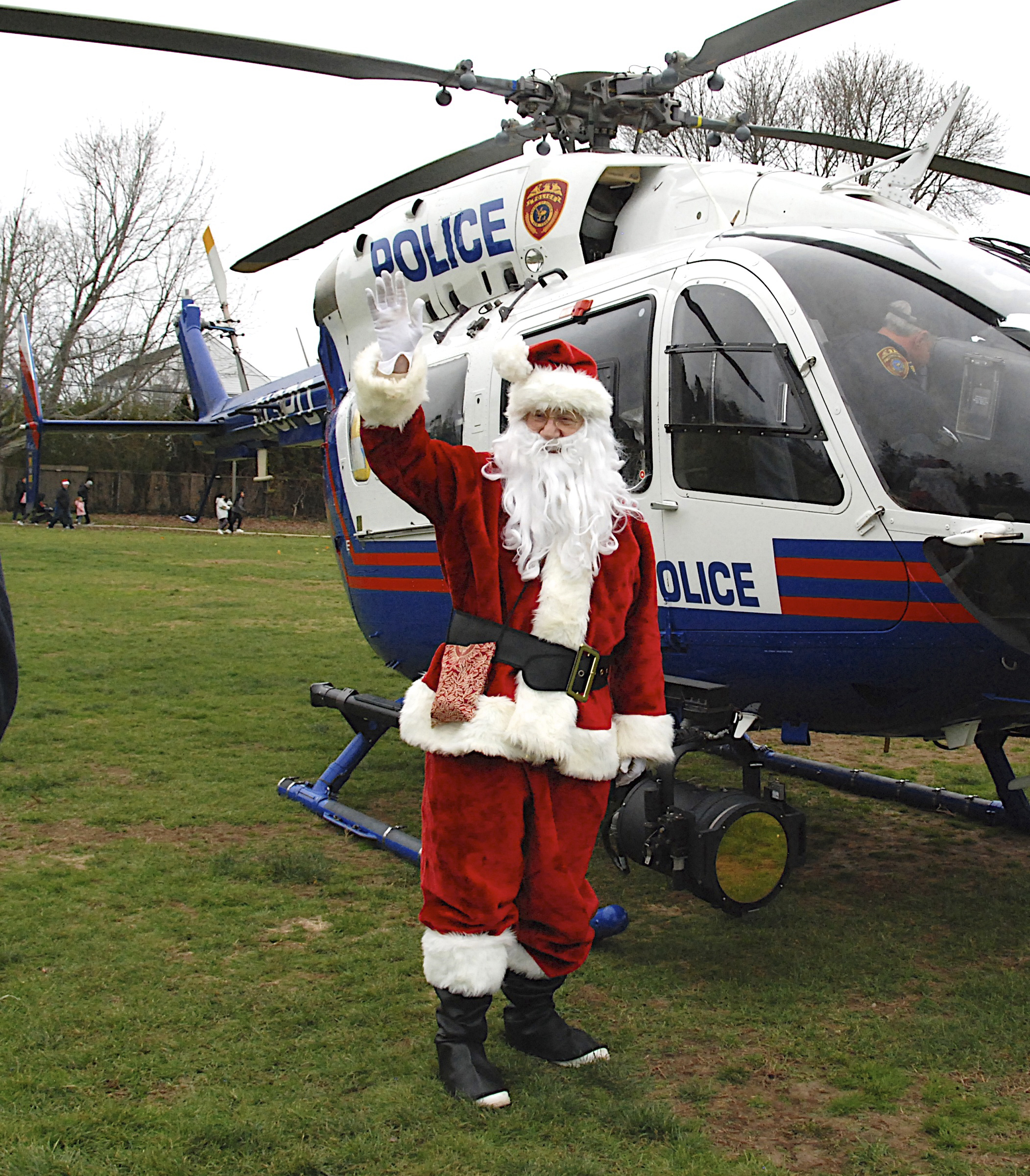 Santa arrived in Herrick Park in East Hampton via a Suffolk County Police helicopter on Saturday afternoon.  KYRIL BROMLEY