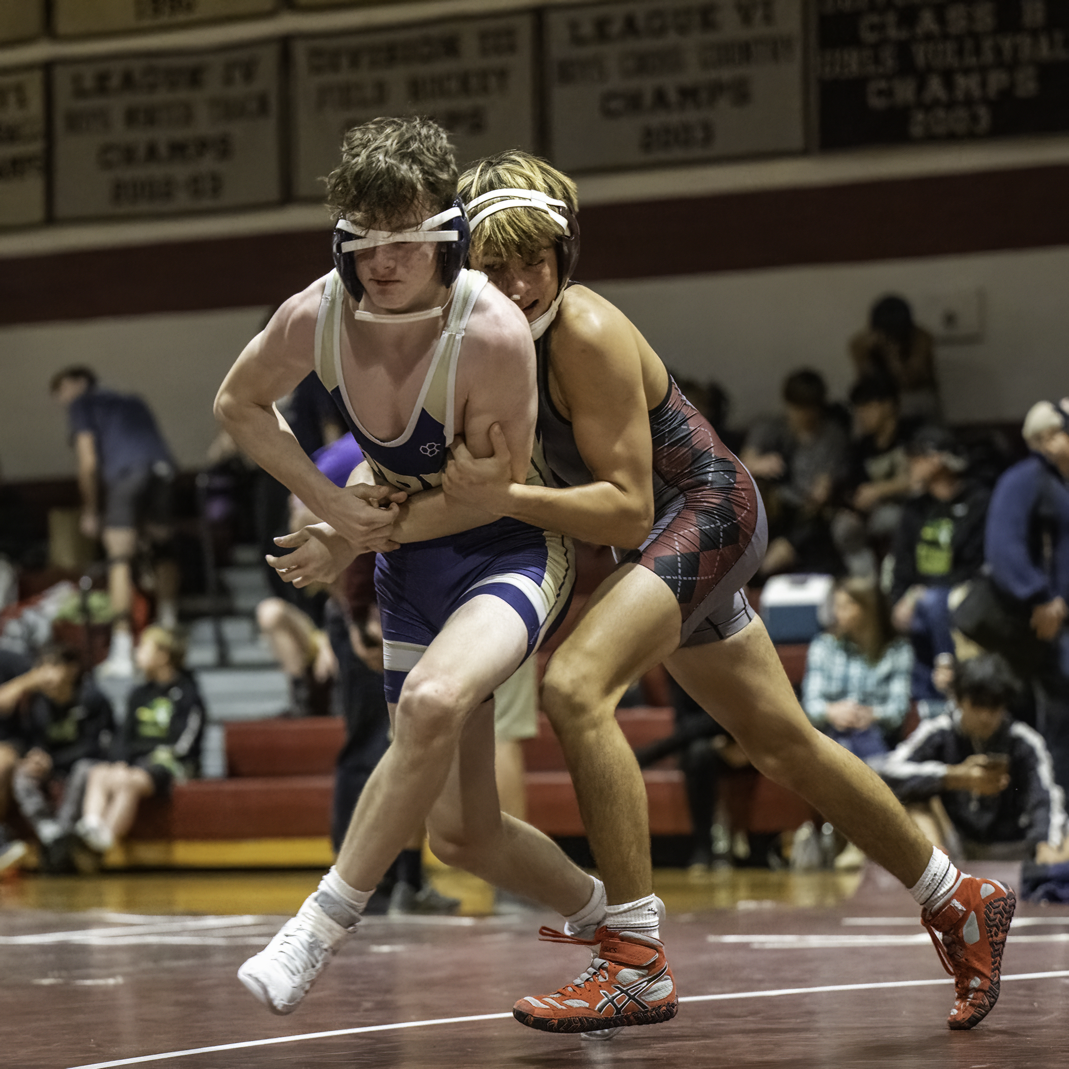 East Hampton senior J.P. Amaden tries to take down a Bayport-Blue Point wrestler.   MARIANNE BARNETT