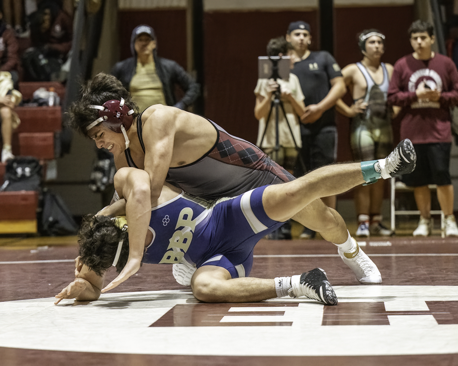 East Hampton junior Jose Calderon makes a on a Bayport-Blue Point wrestler.  
 MARIANNE BARNETT