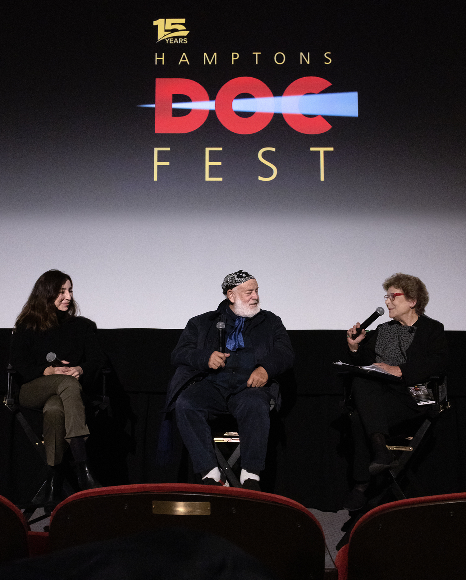Hamptons Doc Fest executive director Jacqui Lofaro, right, leading the Q&A after the screening of “The Treasure of His Youth: The Photographs of Paolo Di Paolo,” on December  4 at Sag Harbor Cinema, with daughter Sylvia Di Paolo (who found the trove of his photos) and director Bruce Weber. CB GRUBB/COURTESY HAMPTONS DOC FEST