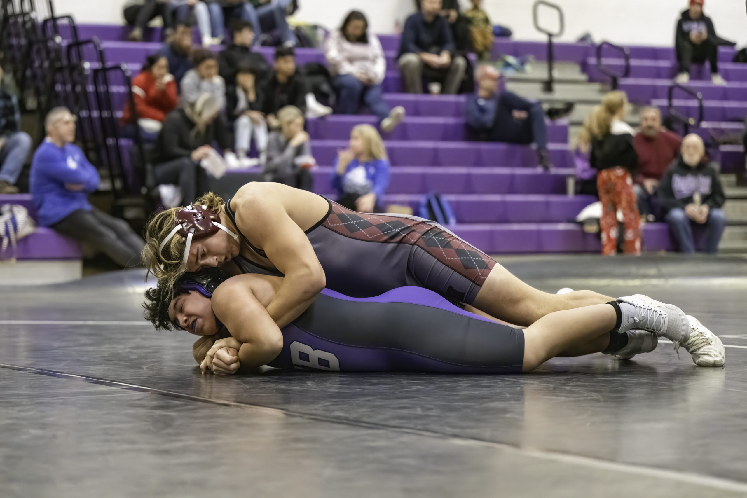East Hampton senior Richie Maio works on top of his Hampton Bays opponent. MARIANNE BARNETT