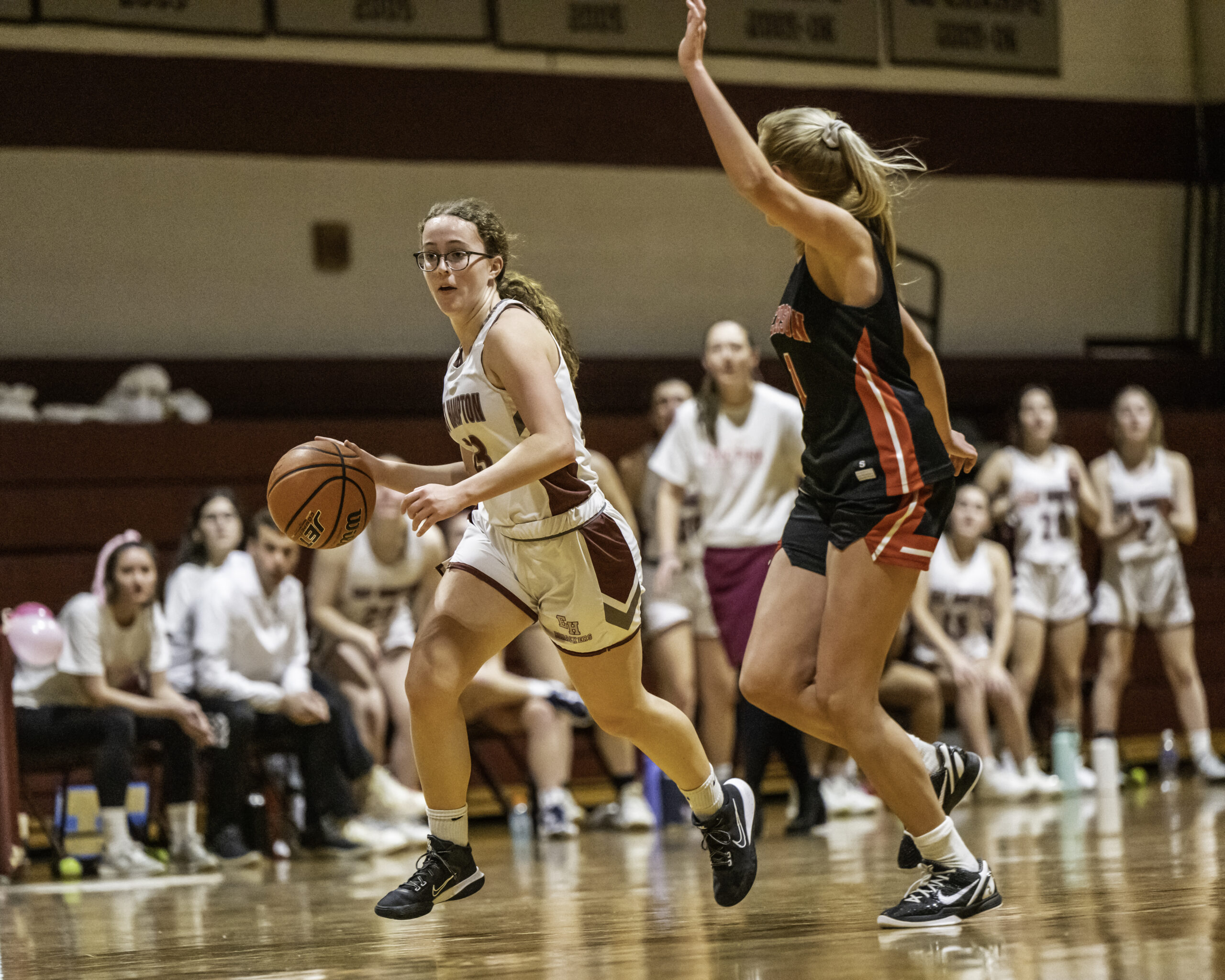 East Hampton's Chloe Swickard dribbles the ball down the court with Pierson's Coco Lohmiller covering her.    MARIANNE BARNETT