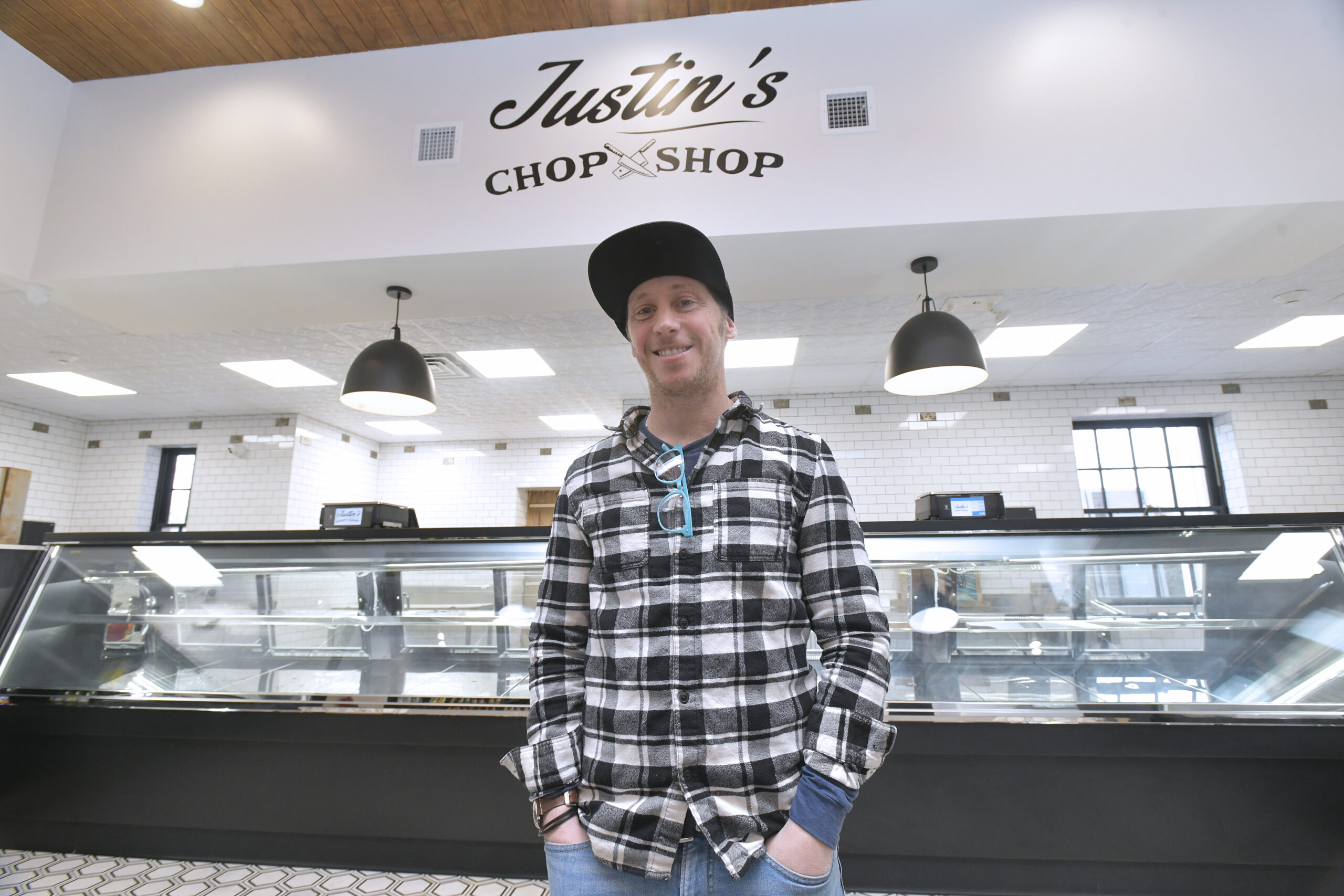 Justin DeMarco at the new location of Justin's Chop Shop in Westhampton Beach.  DANA SHAW
