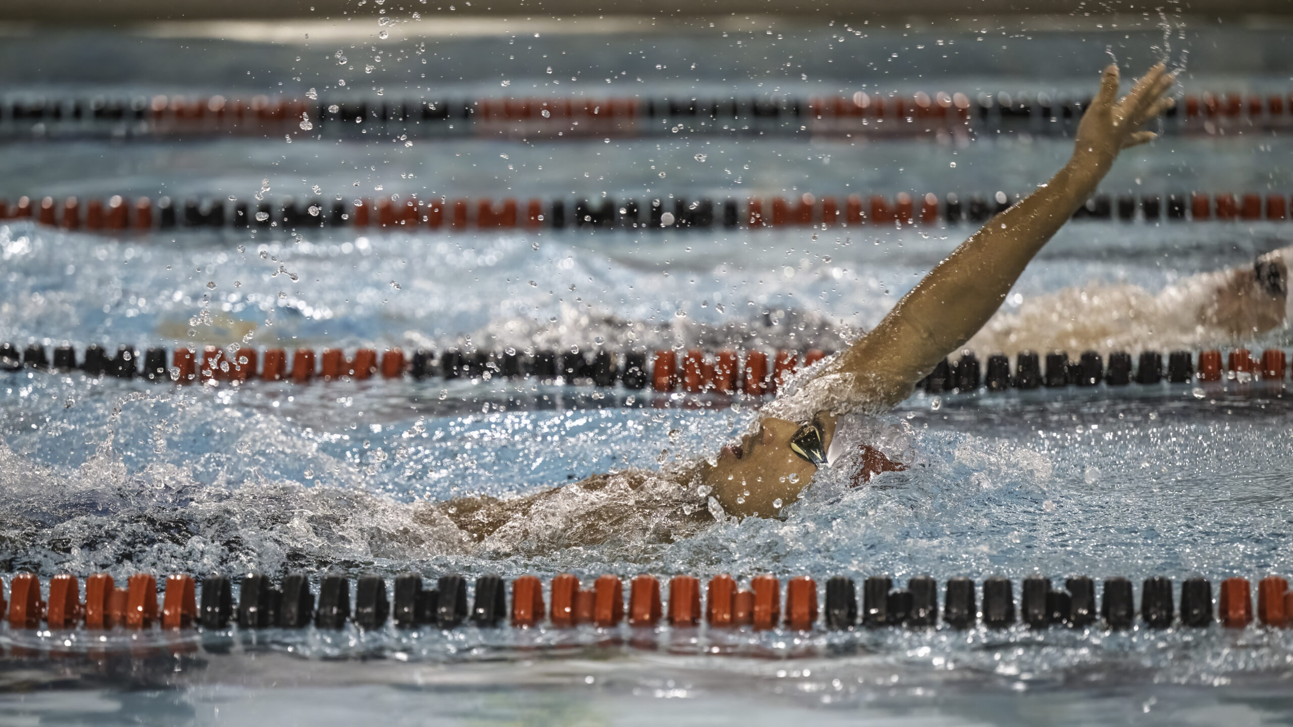 East Hampton's Owen Robins swims the backstroke in a meet on January 6. 
 MARIANNE BARNETT