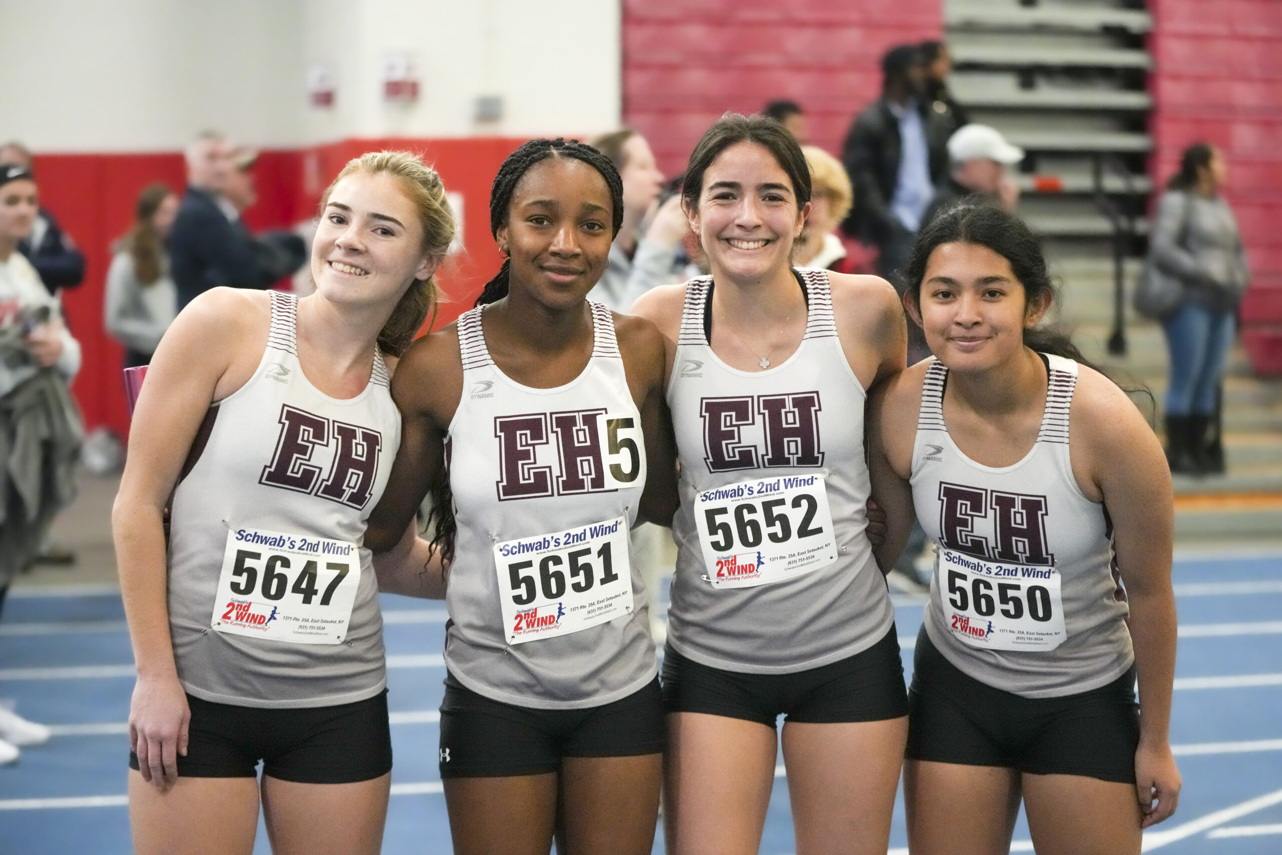 East Hampton’s 4x200-meter relay team, from left, Ryleigh O’Donnell, Leslie Samuel, Melina Sarlo and Sam Ruano.  RON ESPOSITO