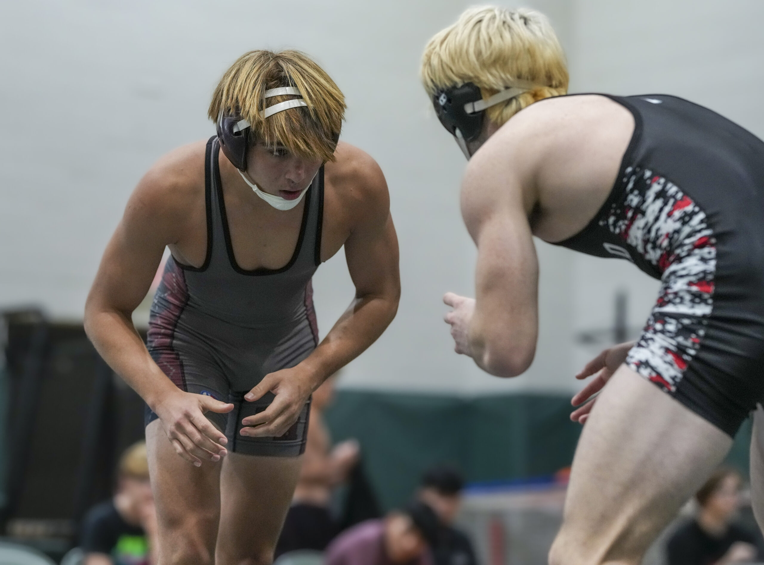 East Hampton senior J.P. Amaden looks for an opening on his Newfield opponent.  RON ESPOSITO