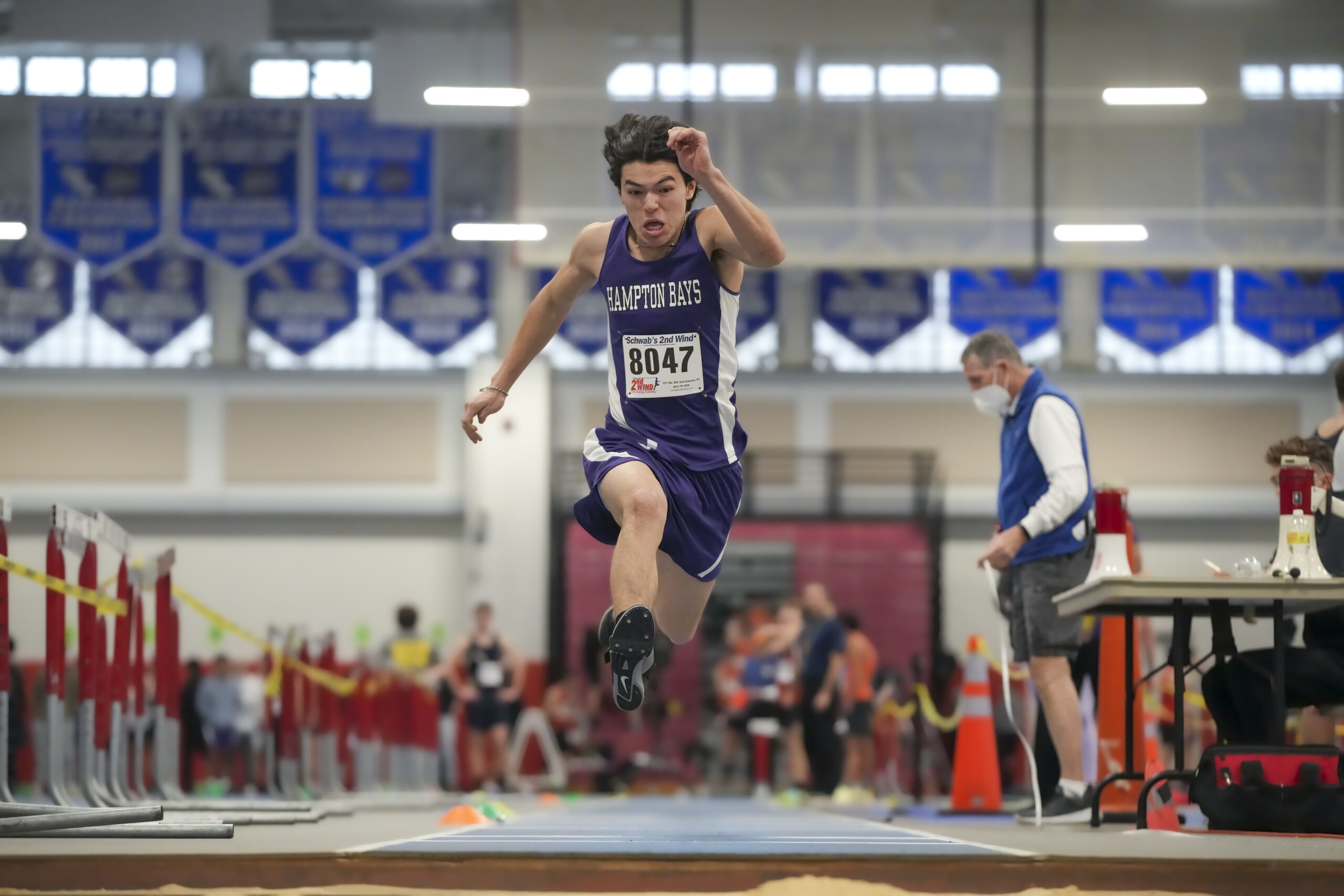 Joffre Proano competing in the jumps for the Baymen.  He placed sixth in the triple jump. RON ESPOSITO