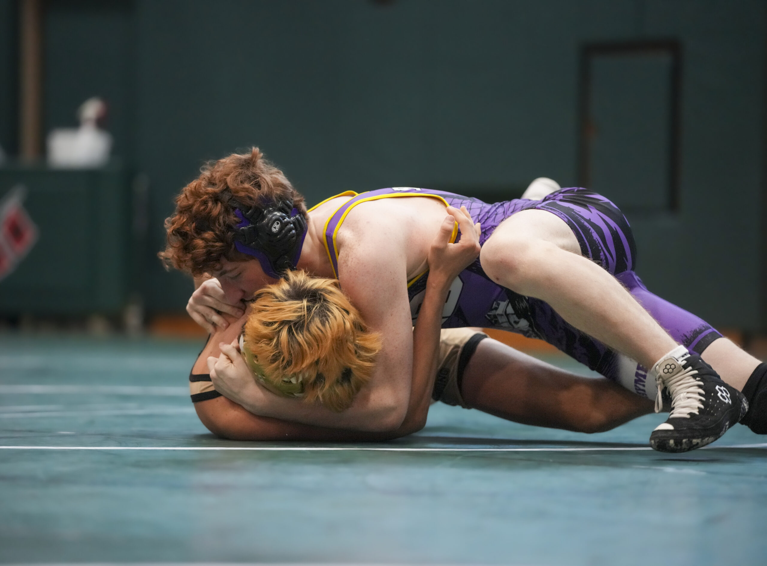 Rocco Gurrera tries to rollover his Sayville opponent to his back.   RON ESPOSITO