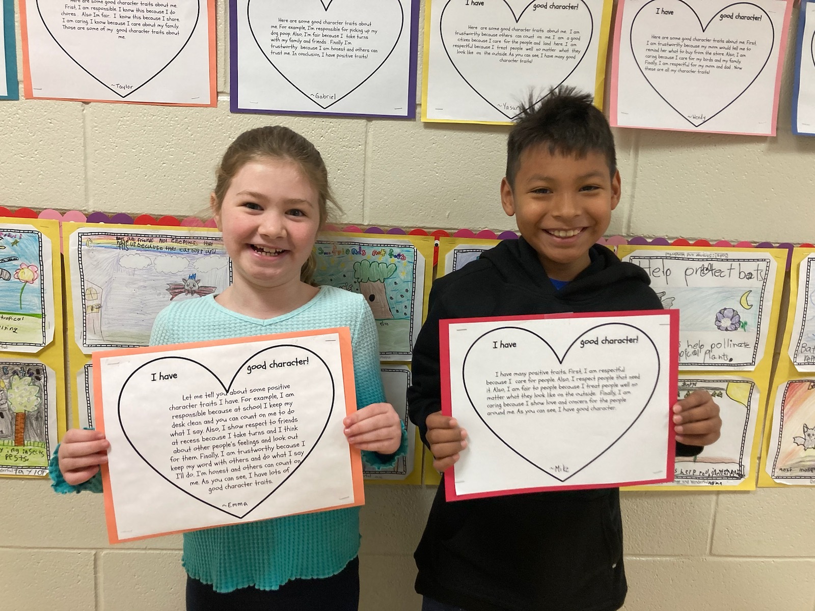 Hampton Bays Elementary School students in Jennifer Warren’s third grade class have been engaging lessons about  social and emotional health. They recently discussed the six pillars of character, which are fairness, responsibility, trustworthiness, caring, respect and citizenship, and what it means to have good character. They also brainstormed examples of these traits in action and wrote about ways they can demonstrate them in their everyday
lives. Emma Kirst, left, and Mike De Los Santos Vasquez were among the students who participated. COURTESY HAMPTON BAYS SCHOOL DISTRICT