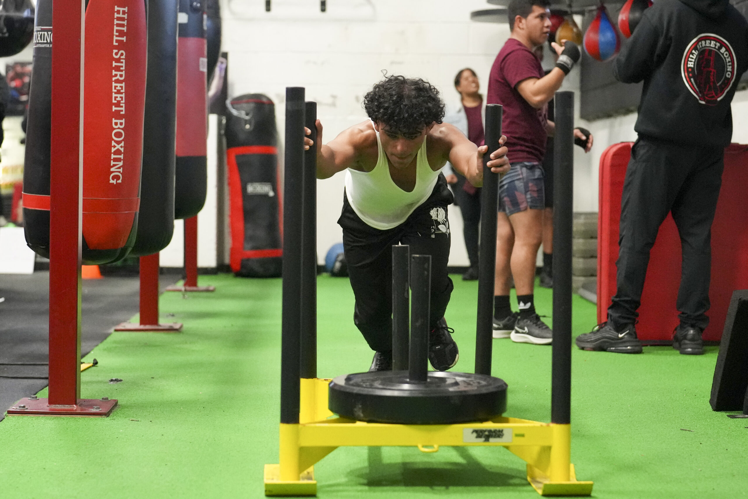Tavita Rosario works out on the sled.   RON ESPOSITO