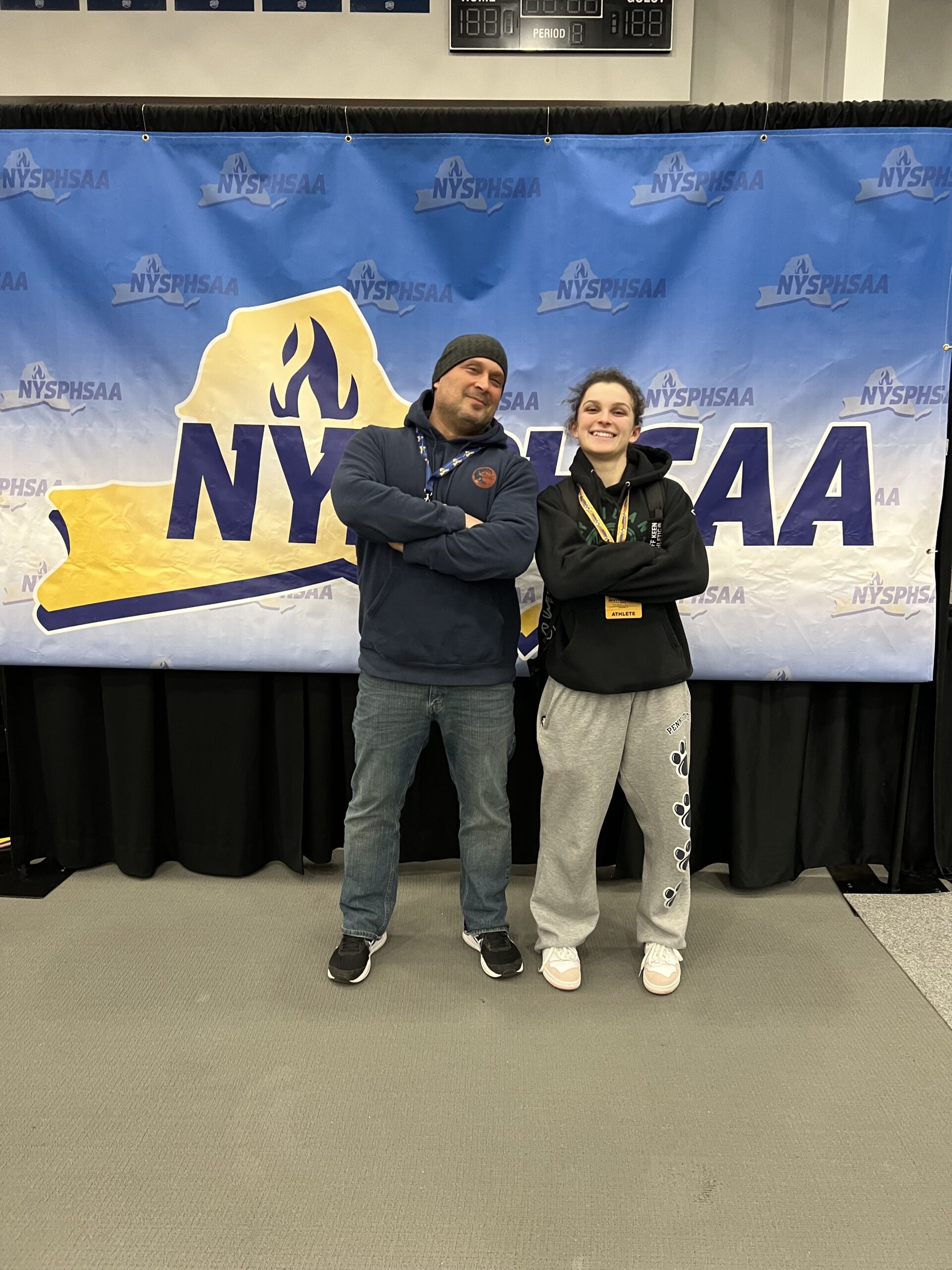 Juliet Barnabee with her father, Kevin Barnabee, at the New York State Girls Wrestling Championships.