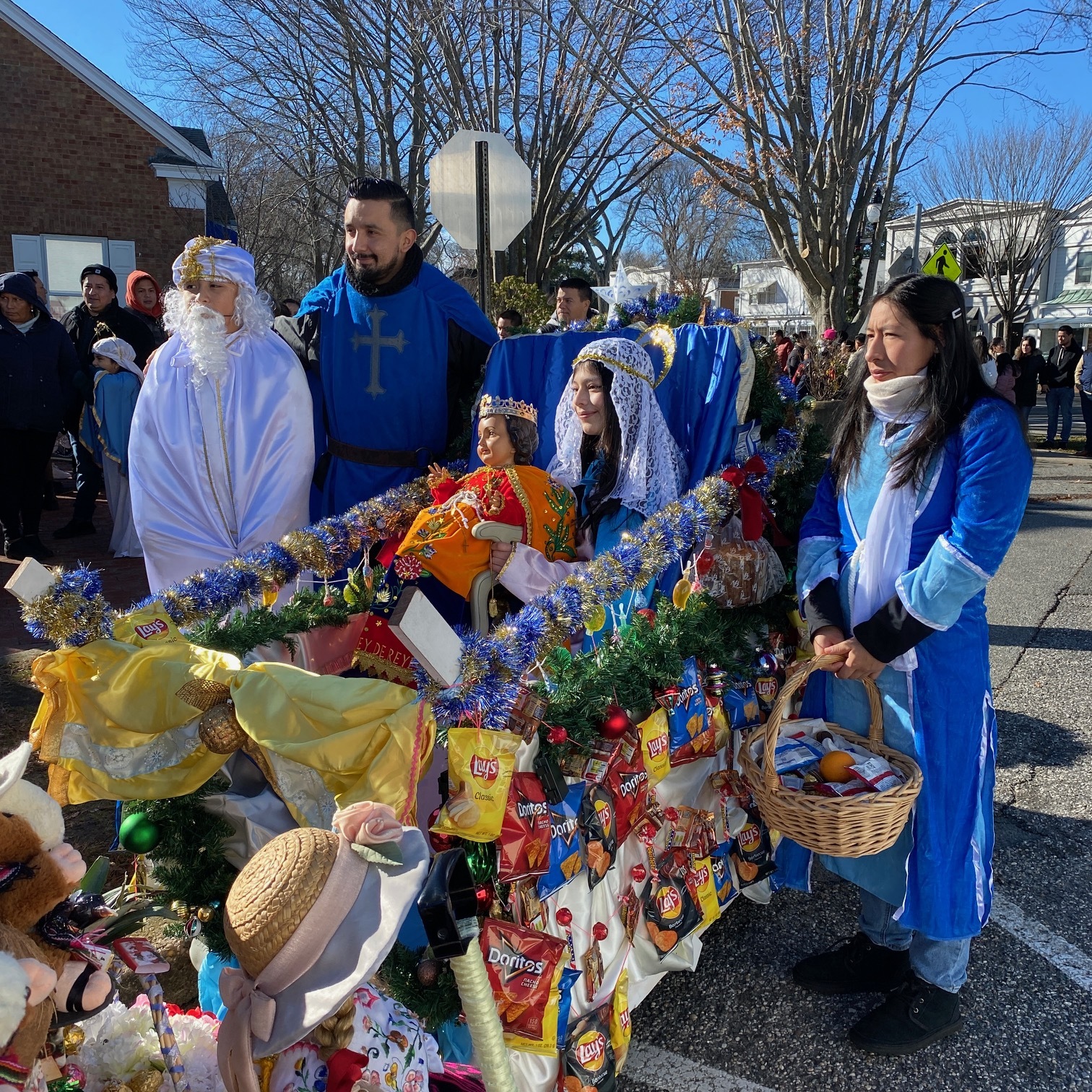 A large crowd gathered in East Hampton Village for Three Kings Day, also known as Epiphany, which celebrates the arrival in Bethlehem of the Three Wise Men bearing gifts for the baby Jesus. Many participants wore costumes and some children were dressed as baby Jesus. After the gathering off Main Street, the group paraded from there to the Most Holy Trinity Church. KIM COVELL