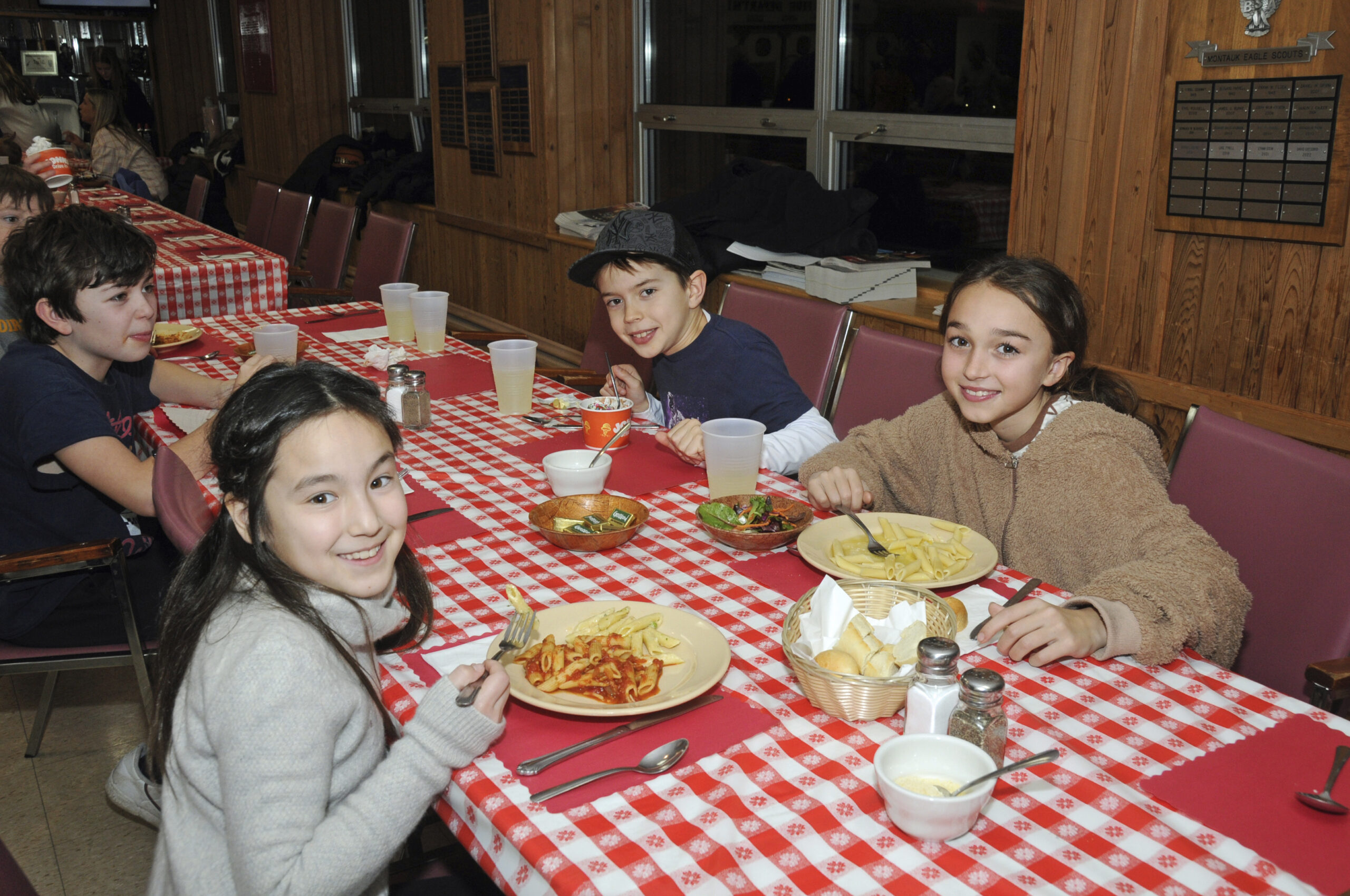 Tippi Tyler, Caelan Ferguson and Riley O'Brien  at the Montauk School PTA's  pasta dinner at the Montauk Fire House on Saturday.    RICHARD LEWIN
