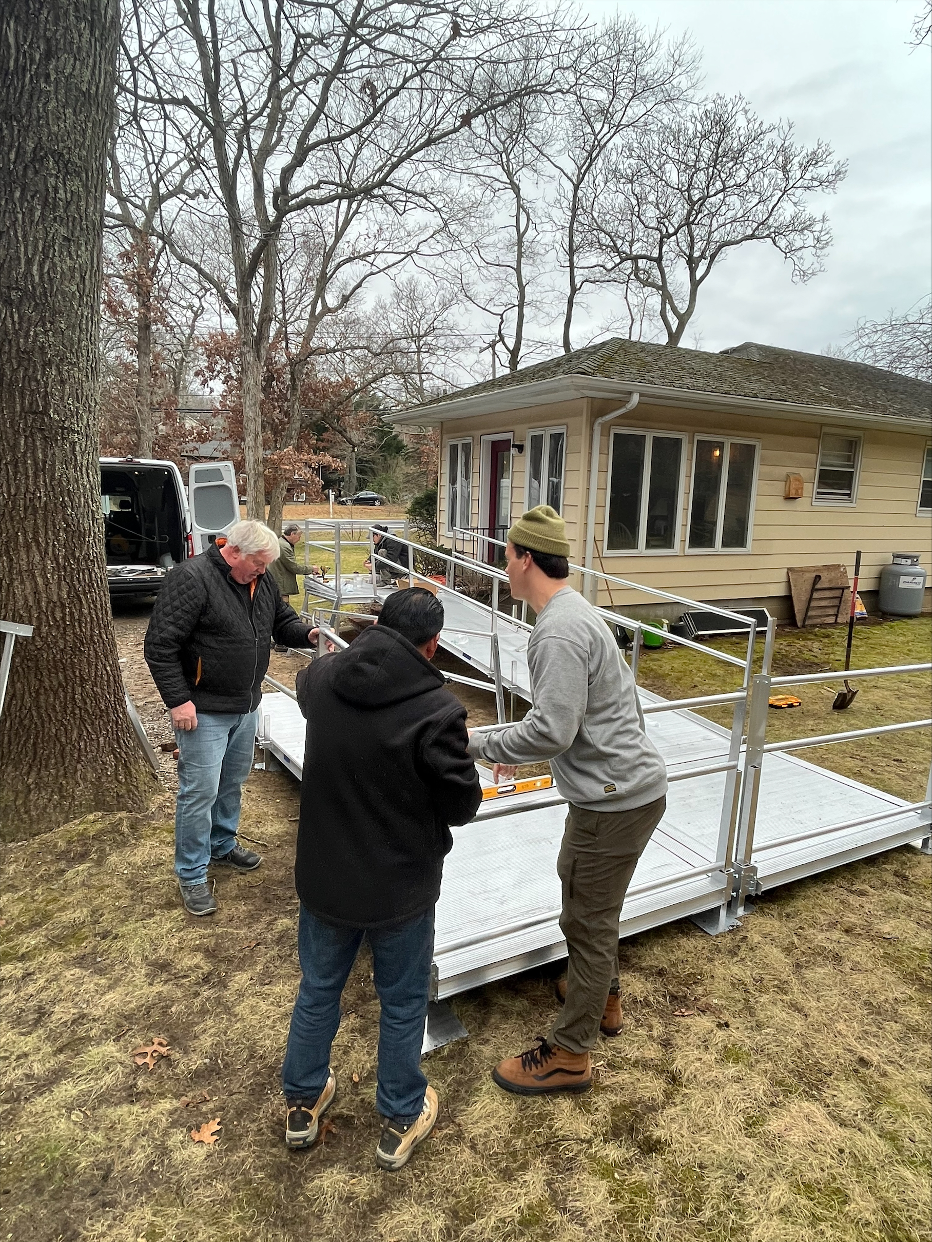 A team of volunteers installs a wheelchair ramp for a Sag Harbor resident in need. JON DIAT