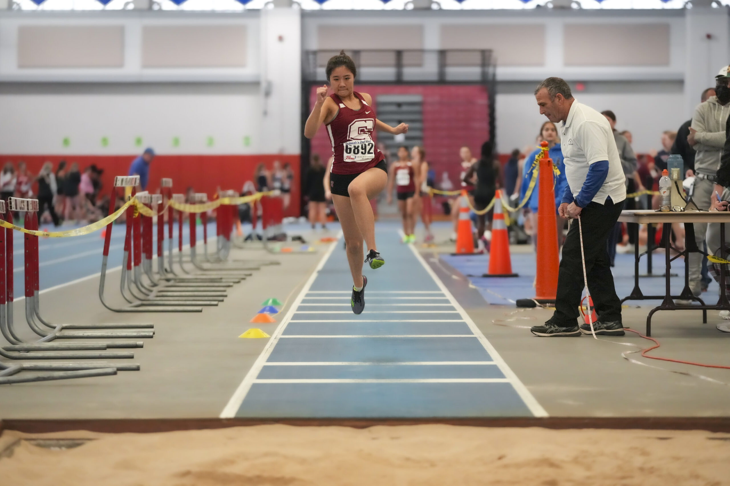 Lily Esposito was one of a handful of Mariners who set personal bests in the triple jump on Sunday.    RON ESPOSITO