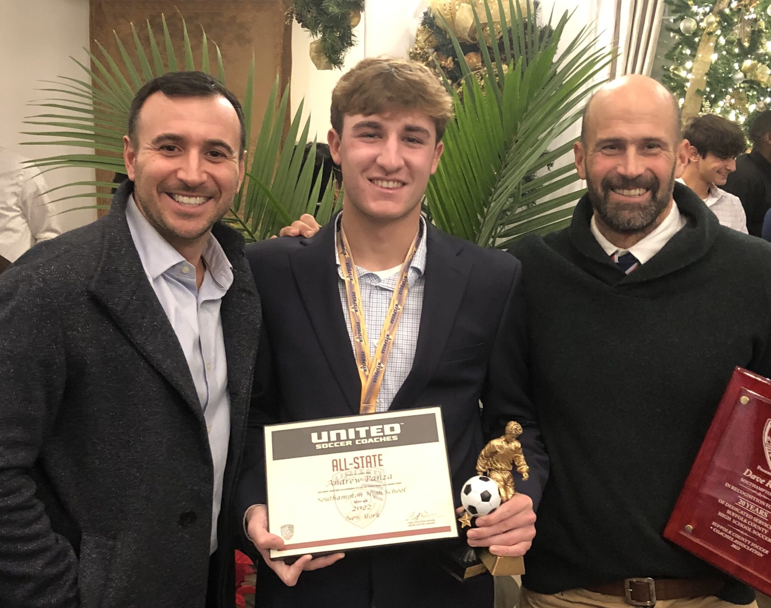 Southampton boys soccer assistant coach Christopher DeRosa, left, with Andy Panza and head coach Dave Riley. Panza was named Fourth Team All-State this past fall.