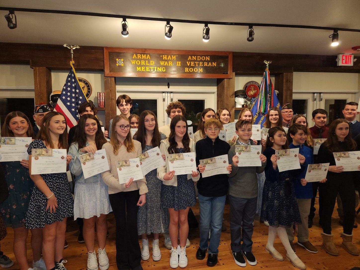 VFW Post 5350 in Westhampton Beach held its Voice of Democracy and Patriots Pen awards on January 26.  Students from Hampton Bays, East Quogue, Raynor Country Day School and Remsenburg-Speonk were recognized for their achievements in this essay and oratorical competition.  Also at the event, the VFW Department of New York Teacher of the Year, Korey Williams a social studies teacher at Westhampton Beach High School and a life member of Post 5350, was recognized for his contributions to the program. COURTESY VFW POST 5350