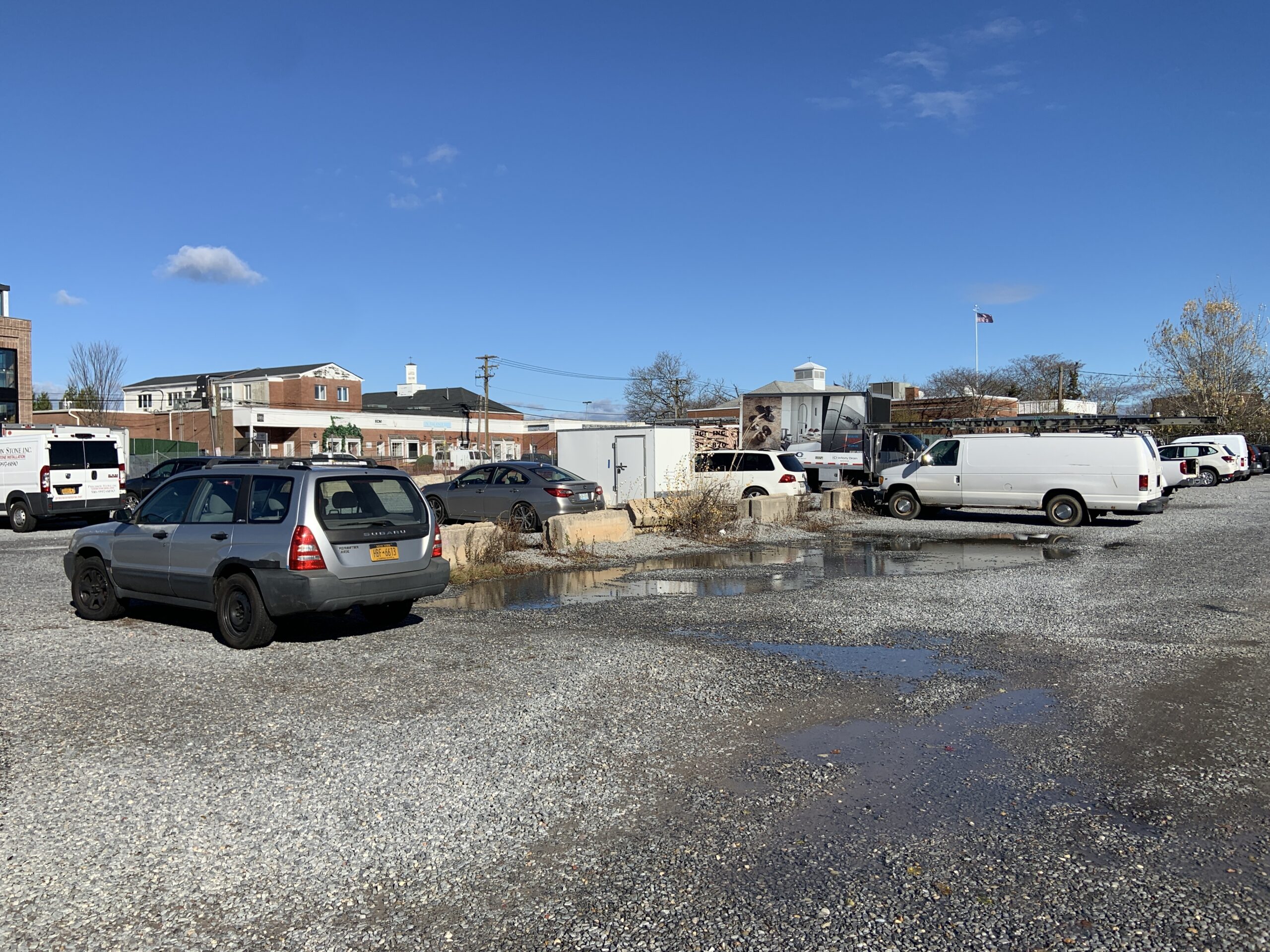 Sag Harbor officials say they were pleased by an interim ruling by the New York State Public Service Commission this week that promised a full review of its petition to gain control of the National Grid gas ball parking lot from developer Adam Potter, whose 11 Bridge Street LLC won the right to lease the property. STEPHEN J. KOTZ