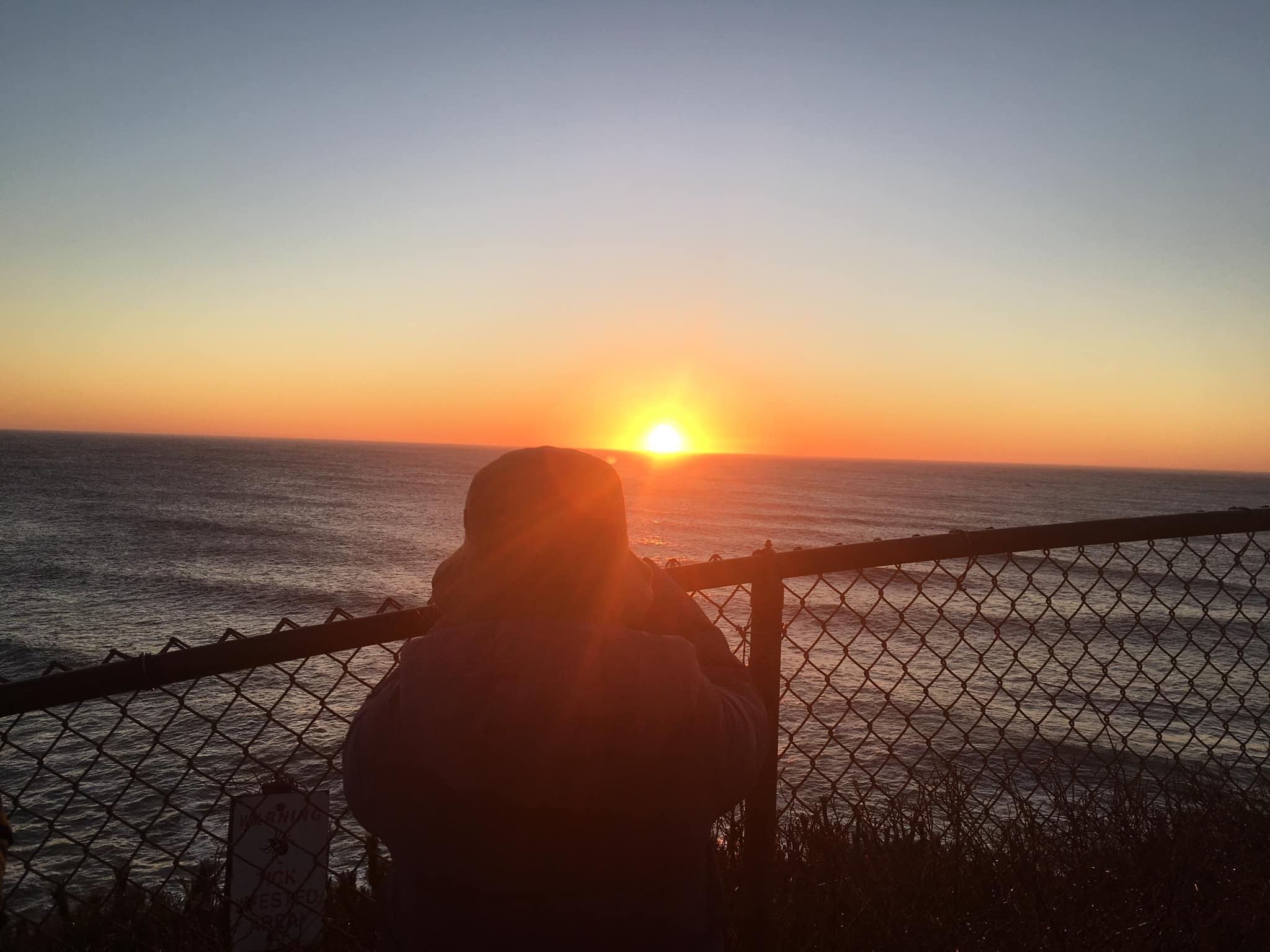 This observer snagged a coveted spot at the fence for the first sunrise of the new year at the Montauk Point Lighthouse.    KITTY MERRILL