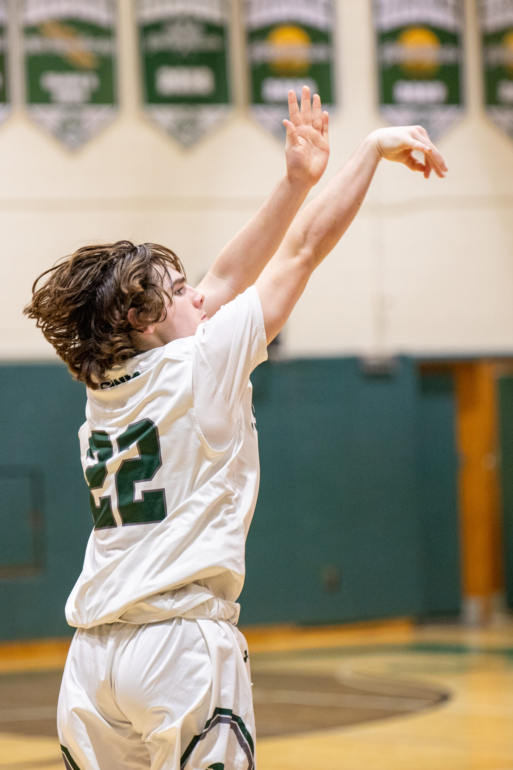 Westhampton Beach freshman Truman Hahn lets go of one of his three pointers. He drained four of them en route to scoring 14 points in his first varsity game.  MICHAEL O'CONNOR