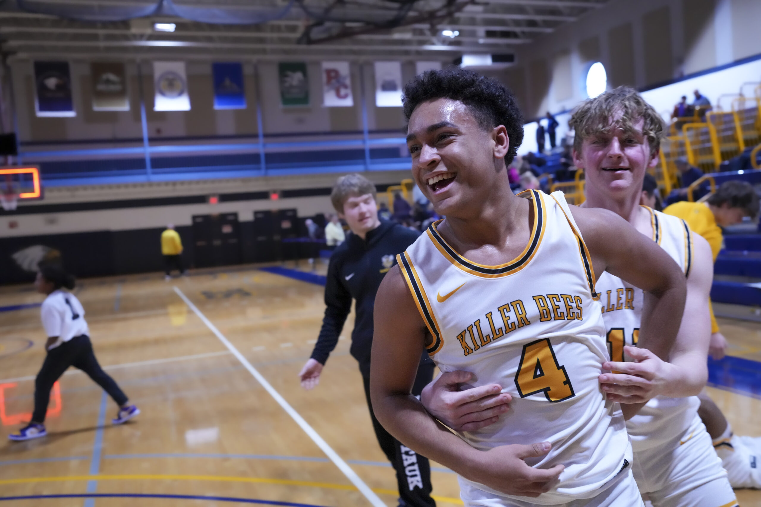 Alex Davis, Dylan Fitzgerald and the Bees were all smiles after the final buzzer went off.   RON ESPOSITO