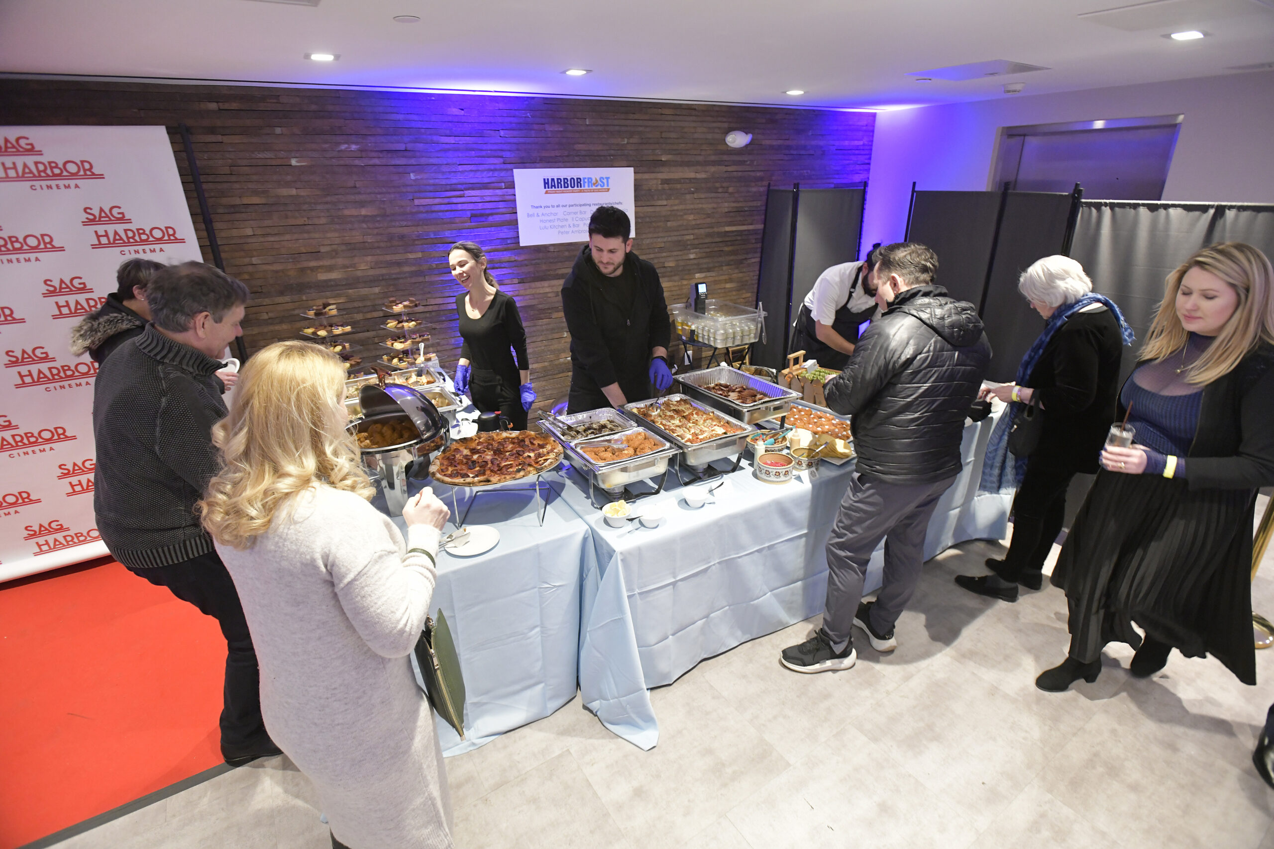 Folks sample the fare at the HarborFrost kickoff party, 