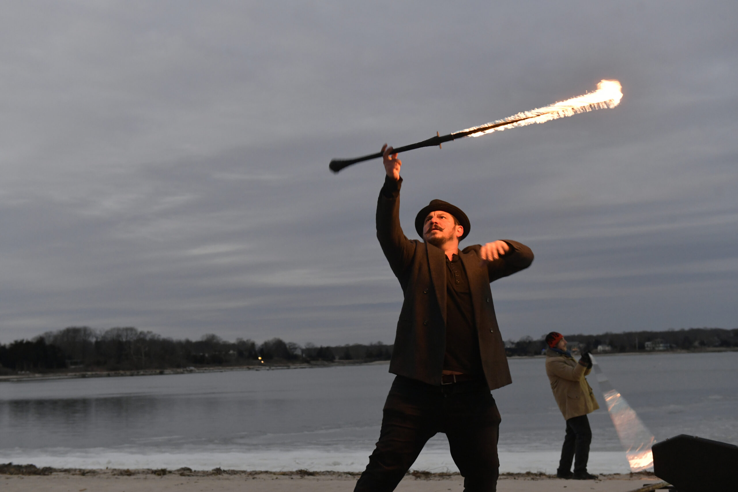Rob Romeo performs during Fire Dancing by Keith Leaf and His Flaming Friends at Windmill Beach on Saturday evening.   DANA SHAW