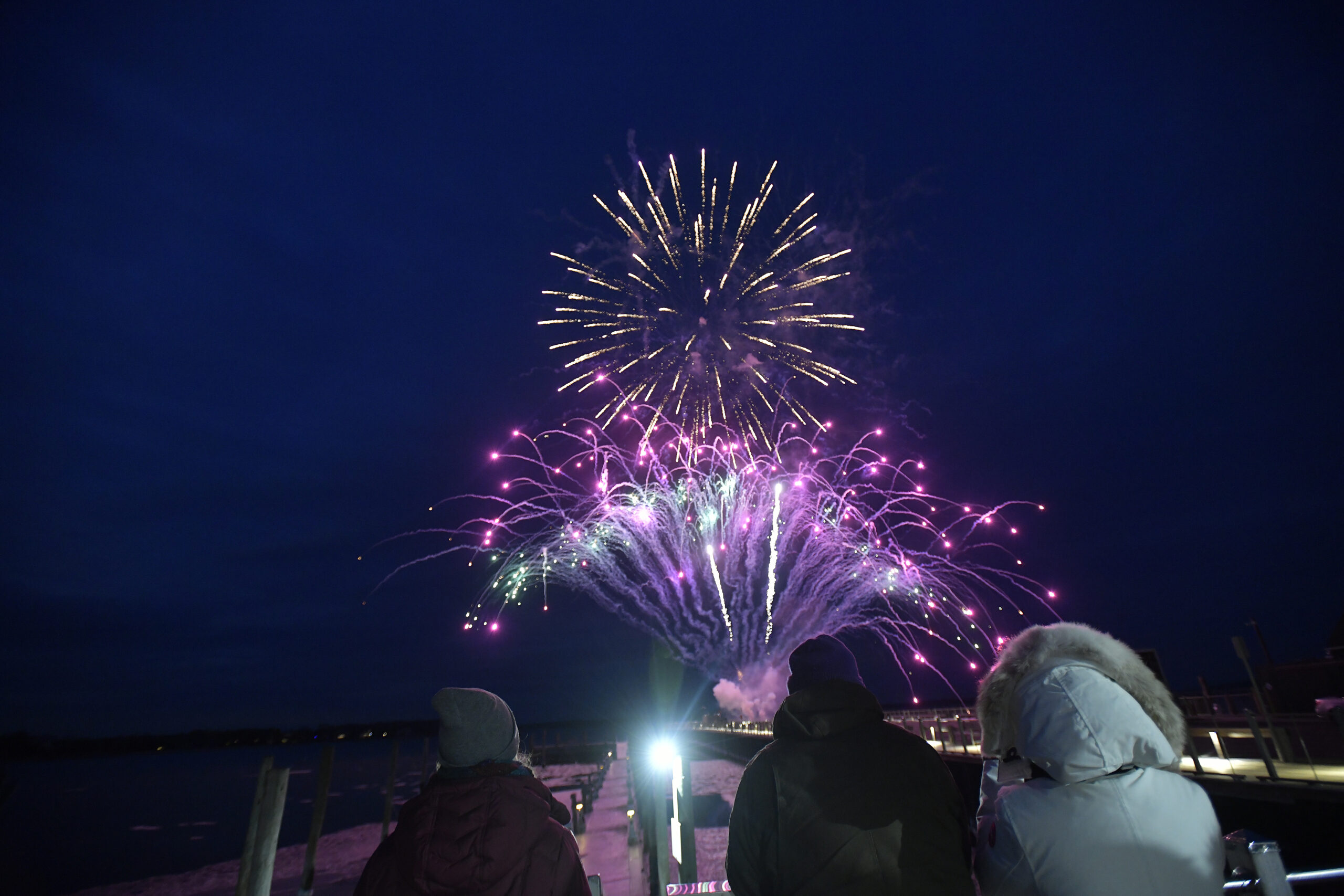 Folks braved the cold to watch fireworks by Grucci off Long Wharf.   DANA SHAW