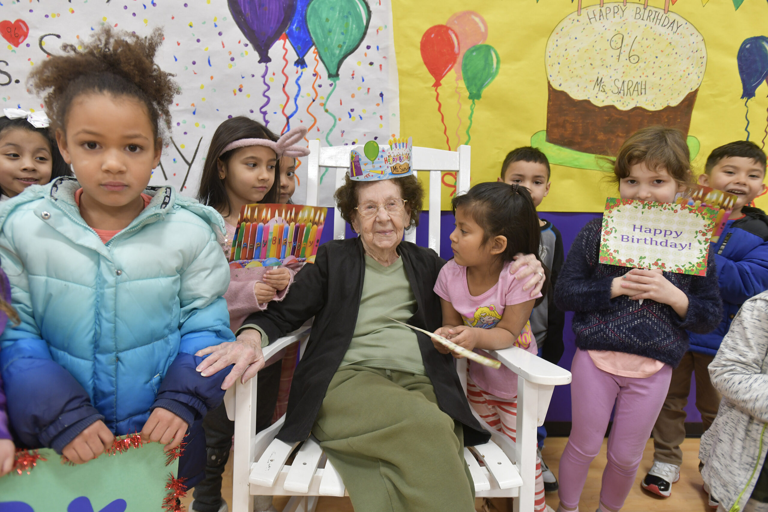 Students at Hampton Bays Elementary School help teaching assistant Sarah Cunlifee celebrate her 96th birthday  on Tuesday morning.  DANA SHAW