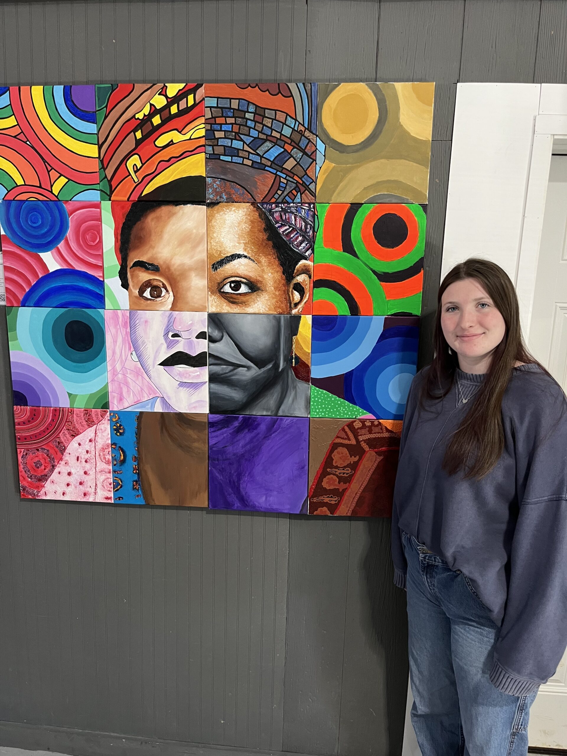 Emelynne Cressy of Center Moriches High School with her collaborative mural of Maya Angelou. ELIZABETH VESPE