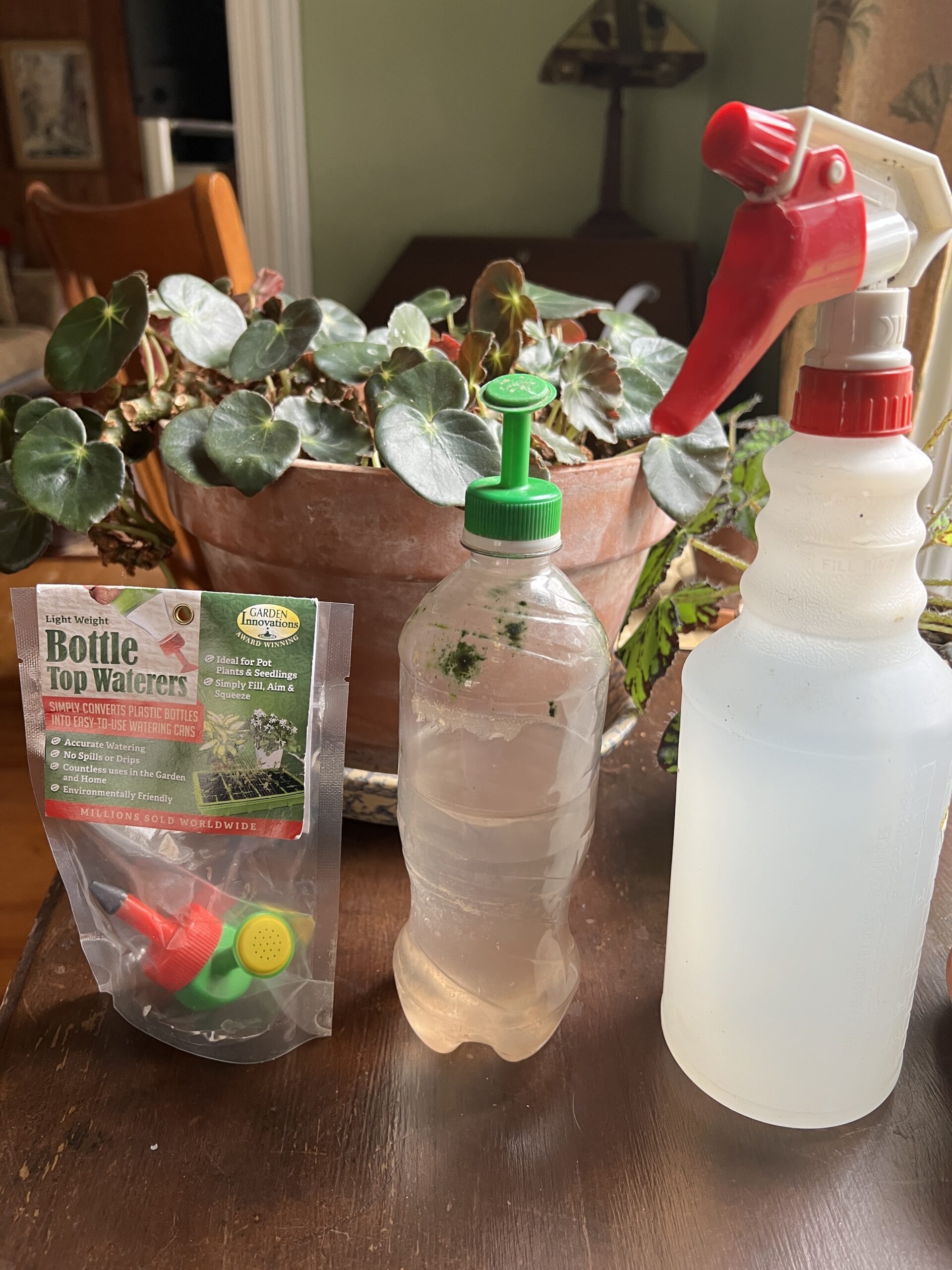 Once seeds are sown in a flat or pot, how do you water them? The best and maybe the safest ways are with an inexpensive spray bottle with an adjustable nozzle (right) or bottle-top waterers as seen on the left and atop a plastic water bottle in the center.
ANDREW MESSINGER