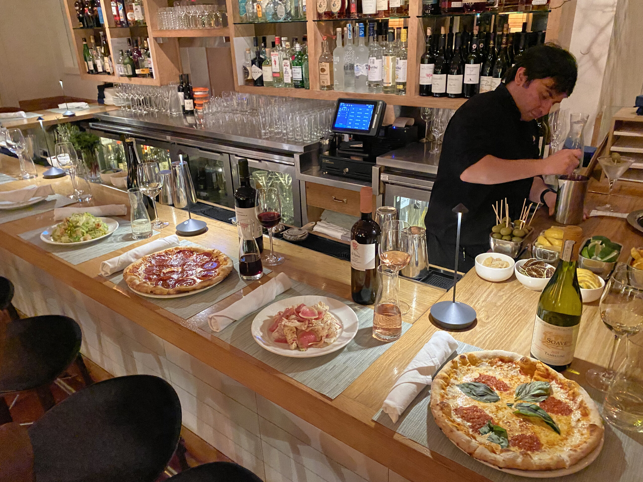 A pizza and wine special is offered at the bar at Nick & Toni's. COURTESY NICK & TONI'S