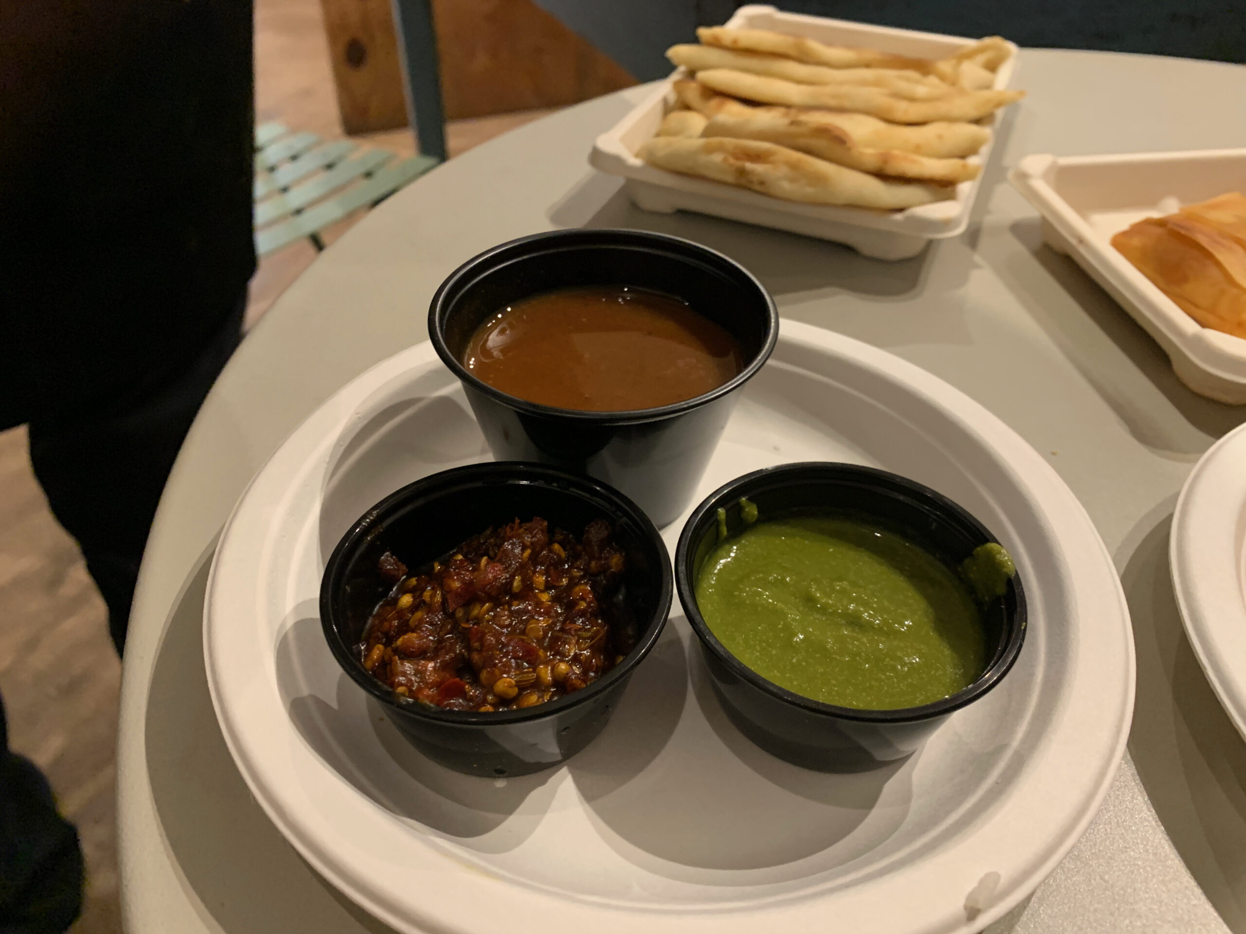 A trio of Ruby Murray's chutneys, tamarind,fresh mint-cilantro and red chili-garlic.  ANNETTE HINKLE