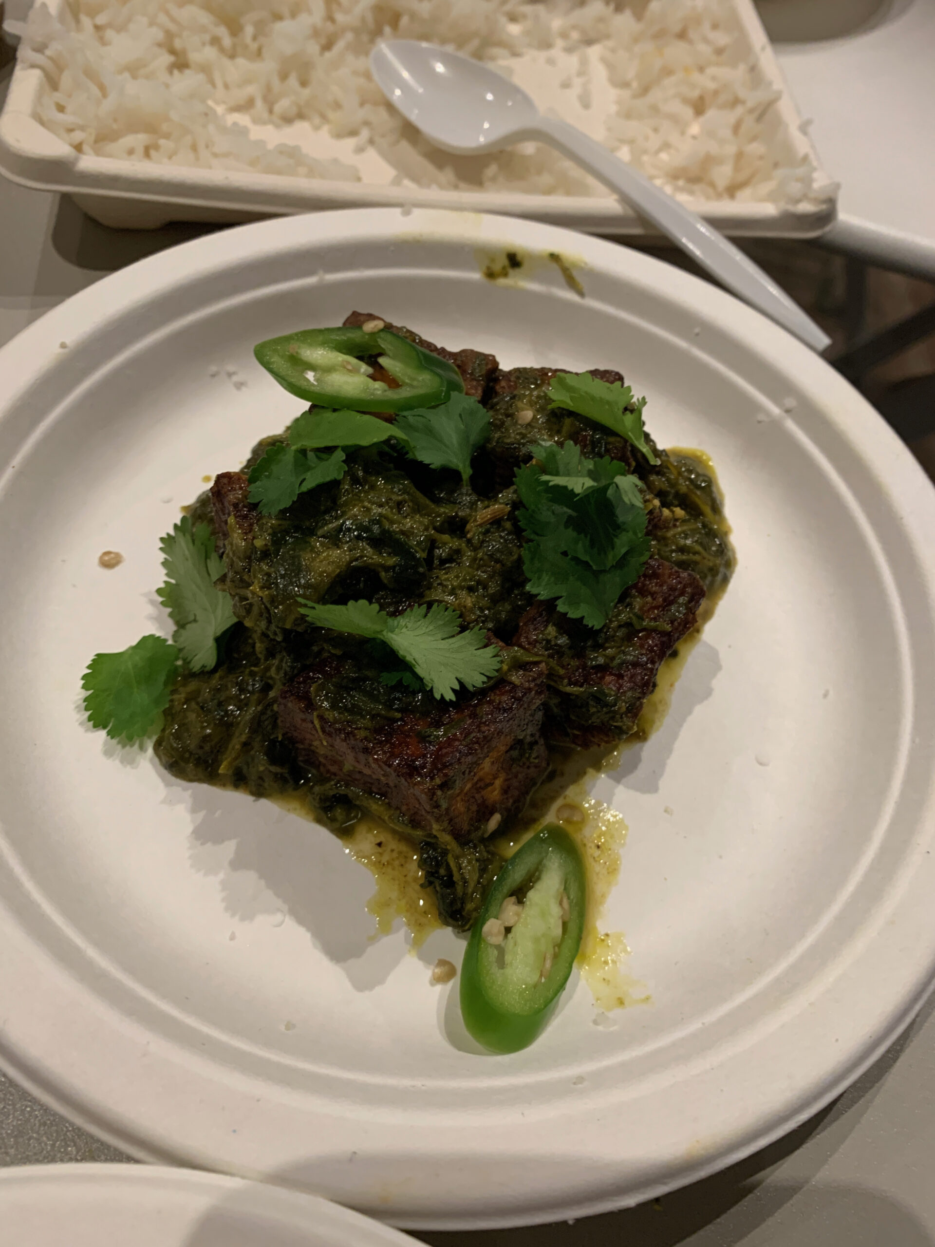 Ruby Murray's Saag Paneer, cheese cubes, tomato and red onion jam, green chili and spinach purée, cilantro. ANNETTE HINKLE
