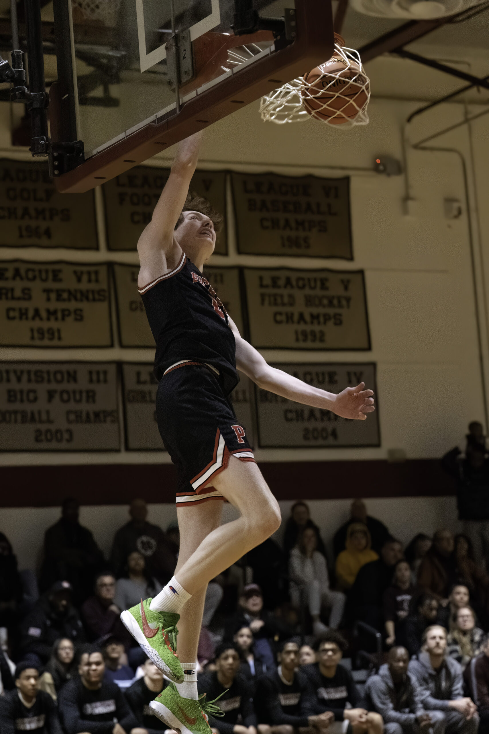 Pierson junior Luke Seltzer with one of two of his dunks on Saturday afternoon.  MARIANNE BARNETT