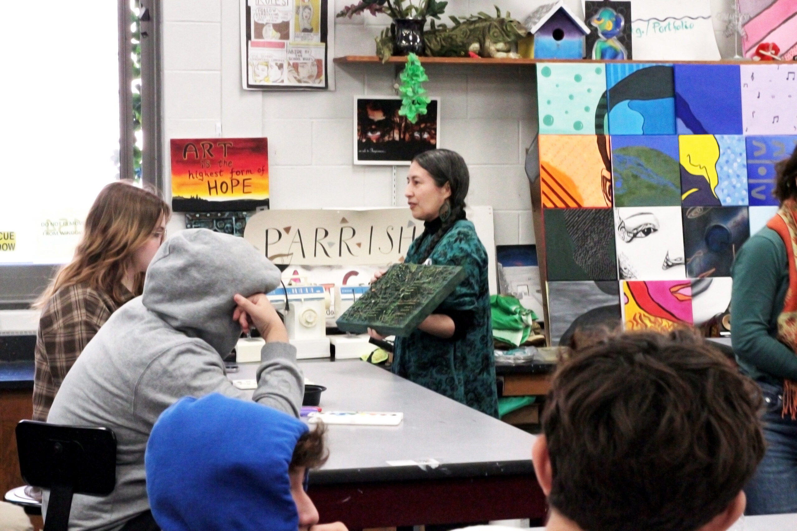 Parrish Art Museum's 2023 artist-in-residence Charlene Charneco works with students in the classroom at Southampton High School. TOM KOCHIE