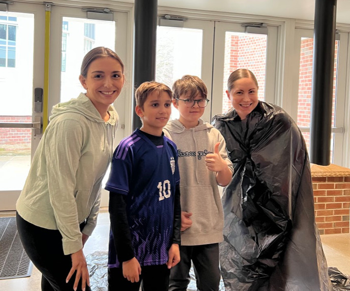 Bridgehampton School sixth grade teacher and students, from left, teacher Julianna Pronesti,
students Chase Chmielewski, Finn Alversa and teacher Julia Conlon. took their math skills to a whole new level on March 14, the annual date to celebrate the mathematical constant of pi. The teachers promoted math literacy as they challenged their students to find out the infinite number of digits in pi.
Student Chase Chmielewski memorized 52 digits of pi and Finn Alversa memorized
29 digits. Both students not only won bragging rights, they were able to 