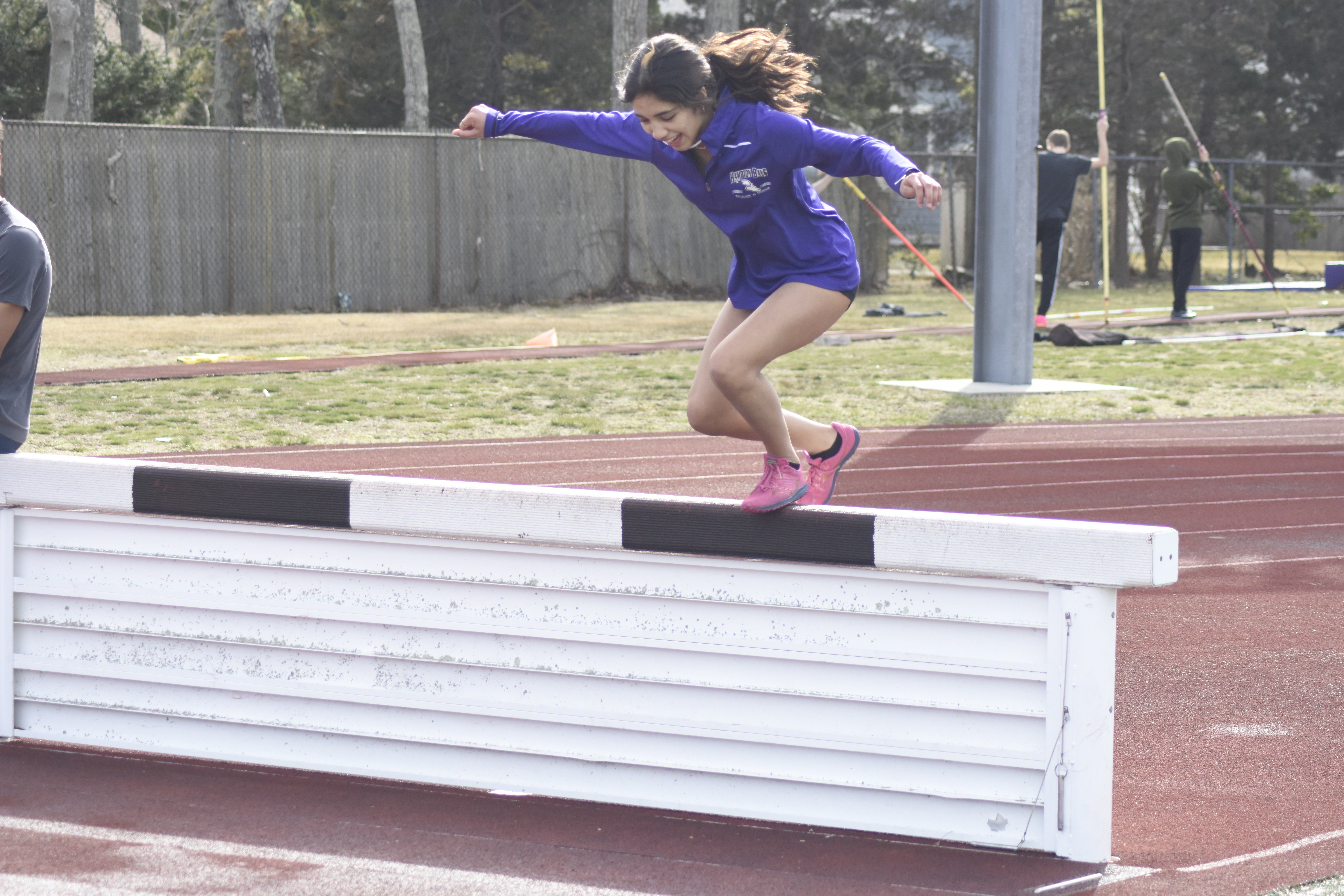 Sofia Galvan works on going over a steeplechase barrier during practice on Friday.   DREW BUDD