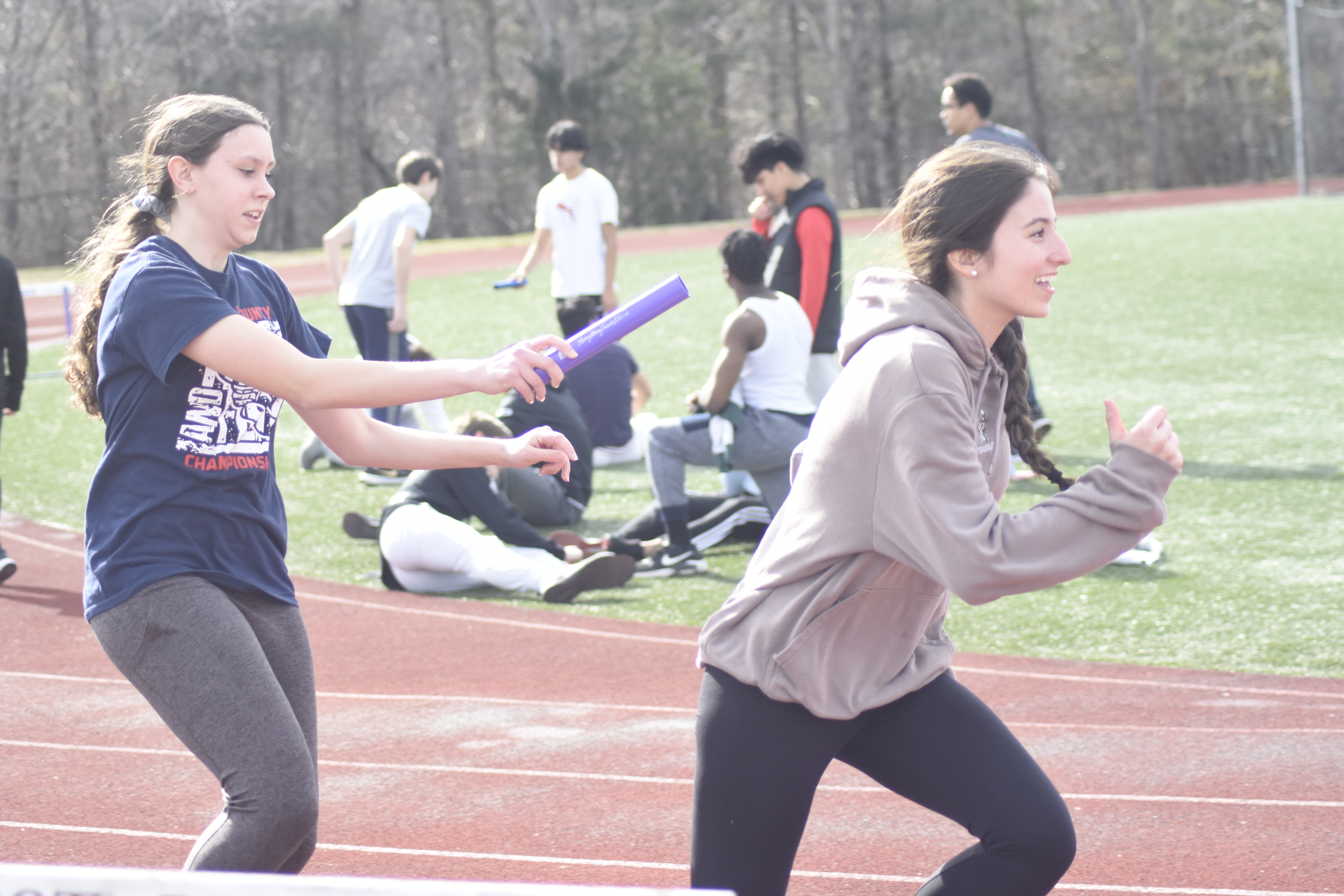 Leah Fassino hands the baton off to Brianna Valderrama.  DREW BUDD